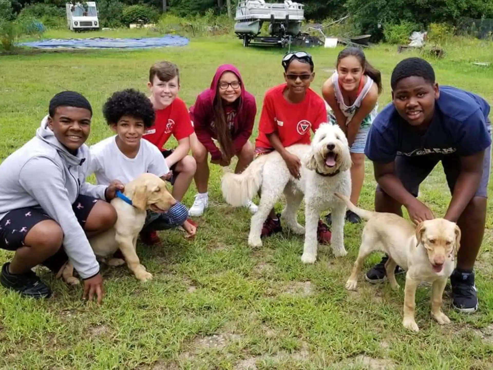 a group of people with dogs