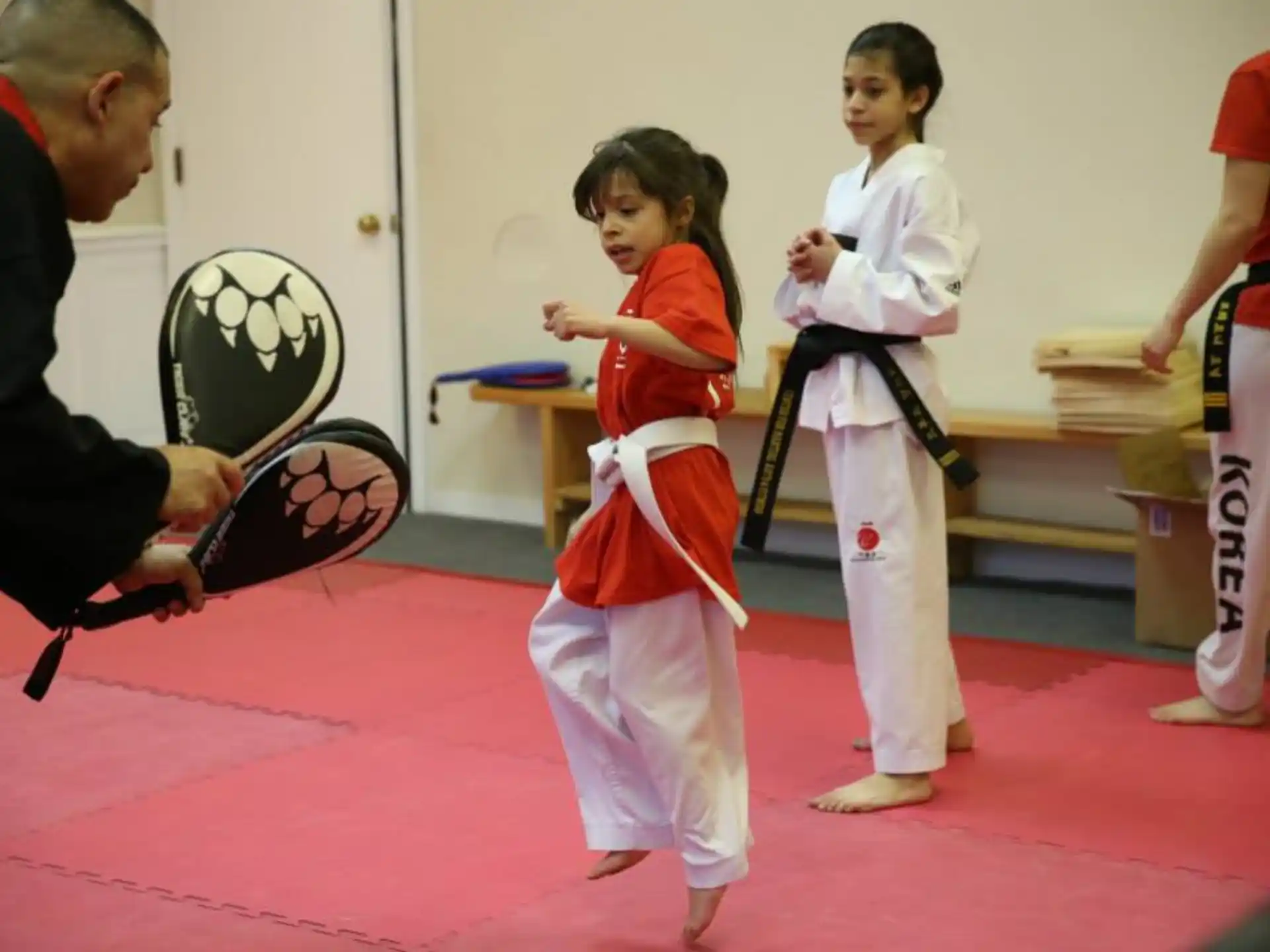 a group of people in karate uniforms