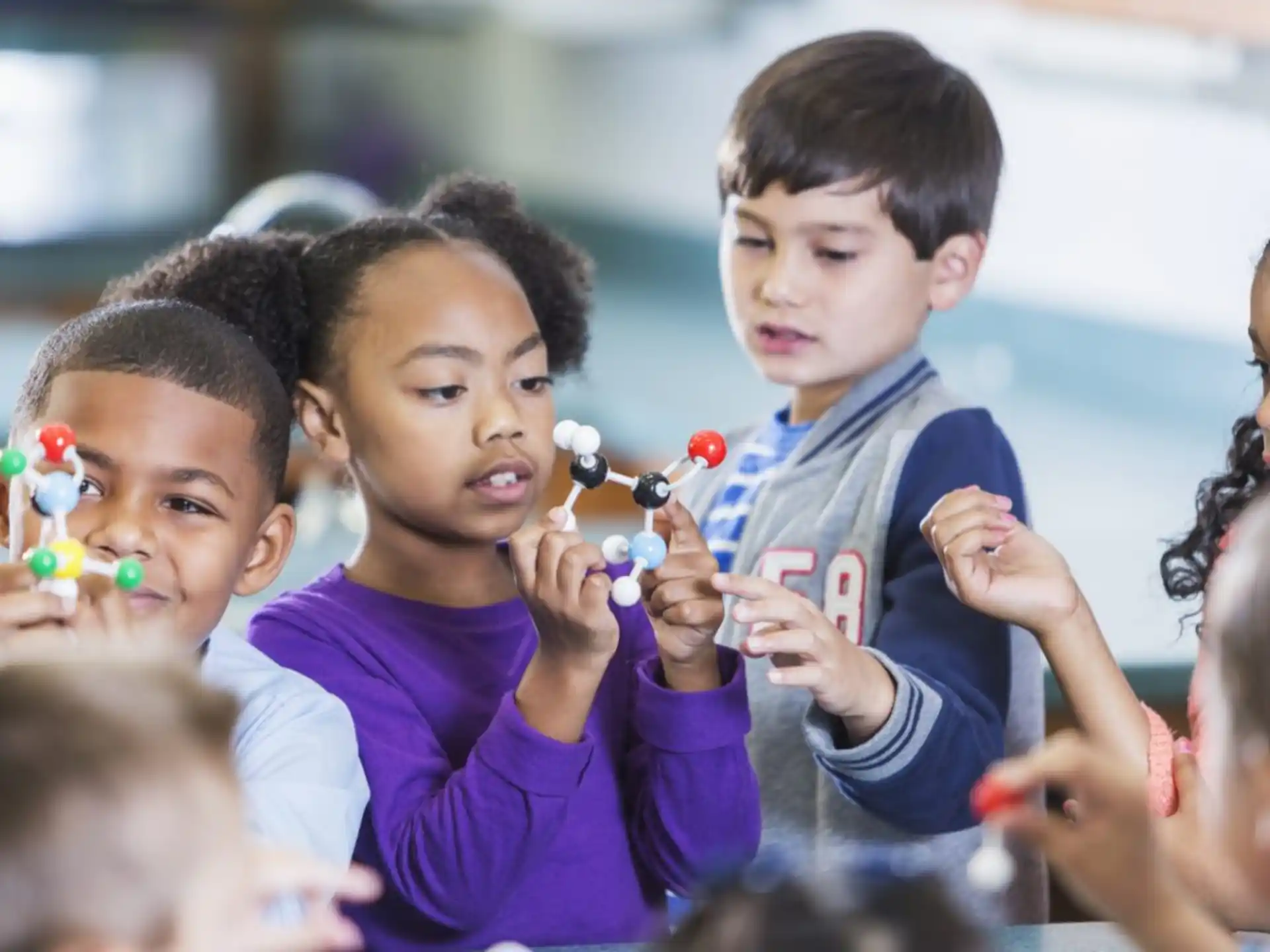 a group of children holding objects