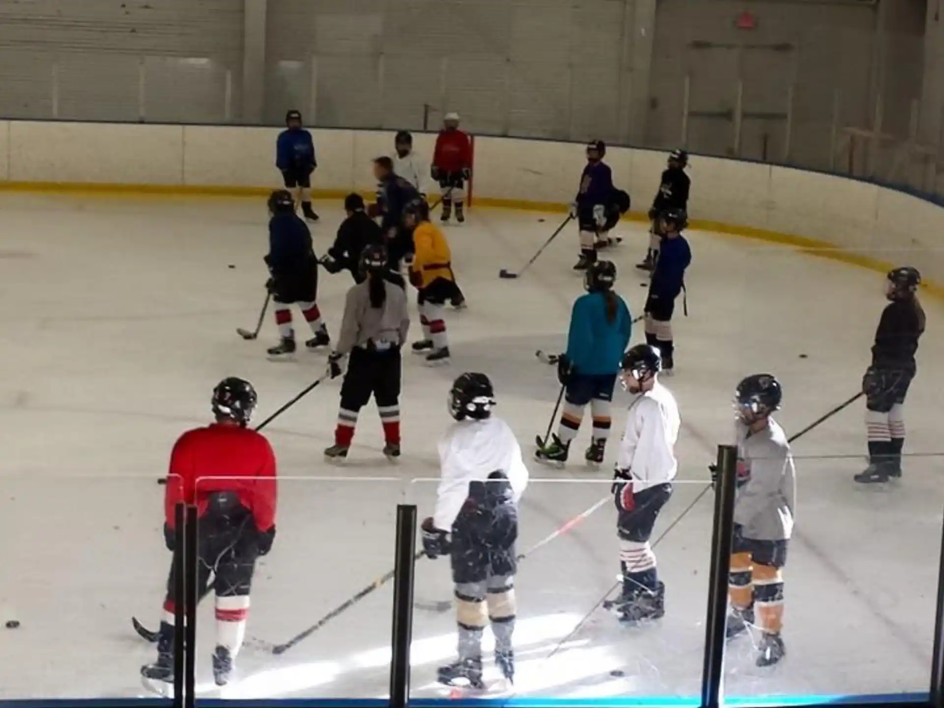 a group of people playing hockey