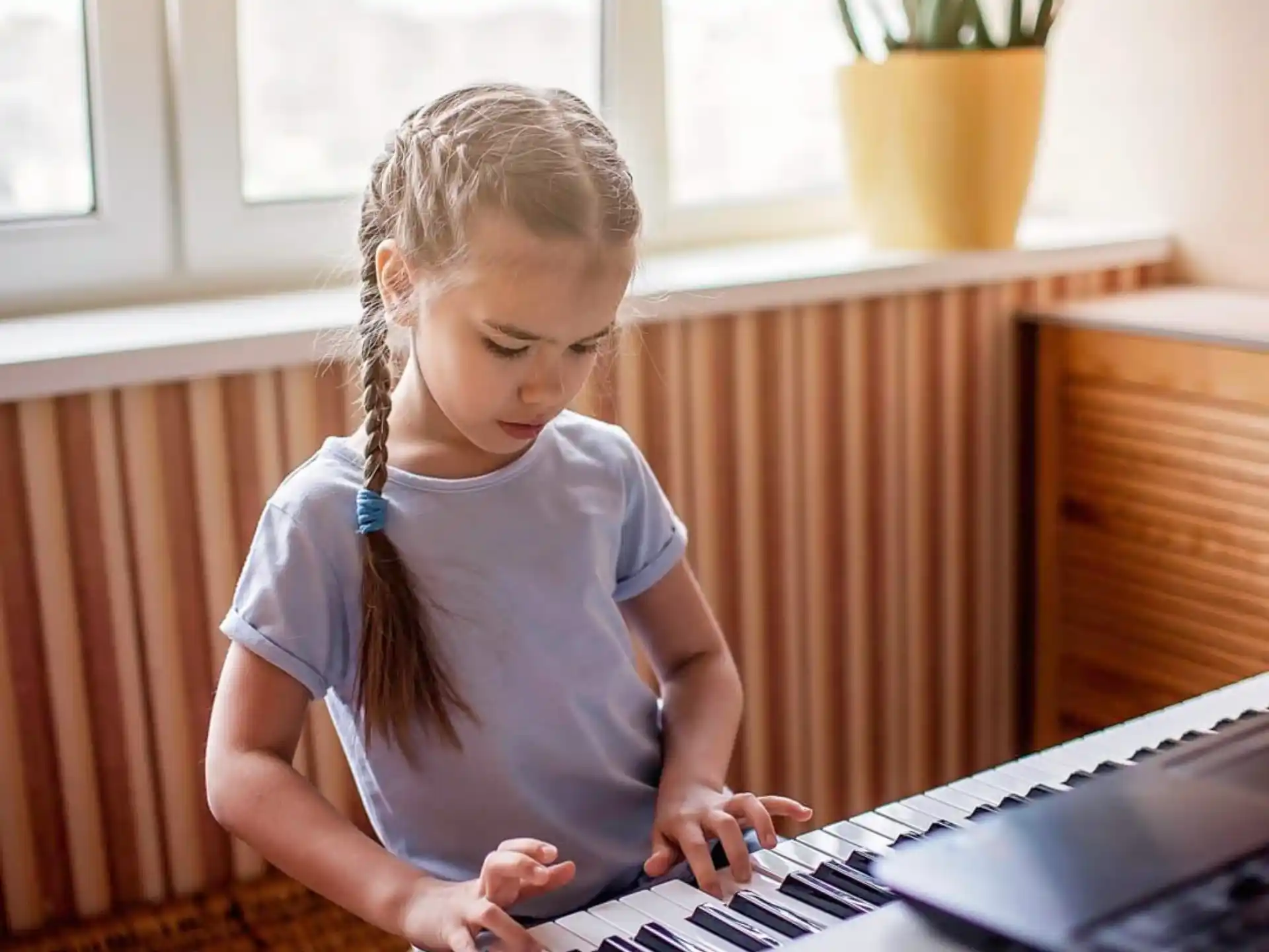 a young girl using a laptop