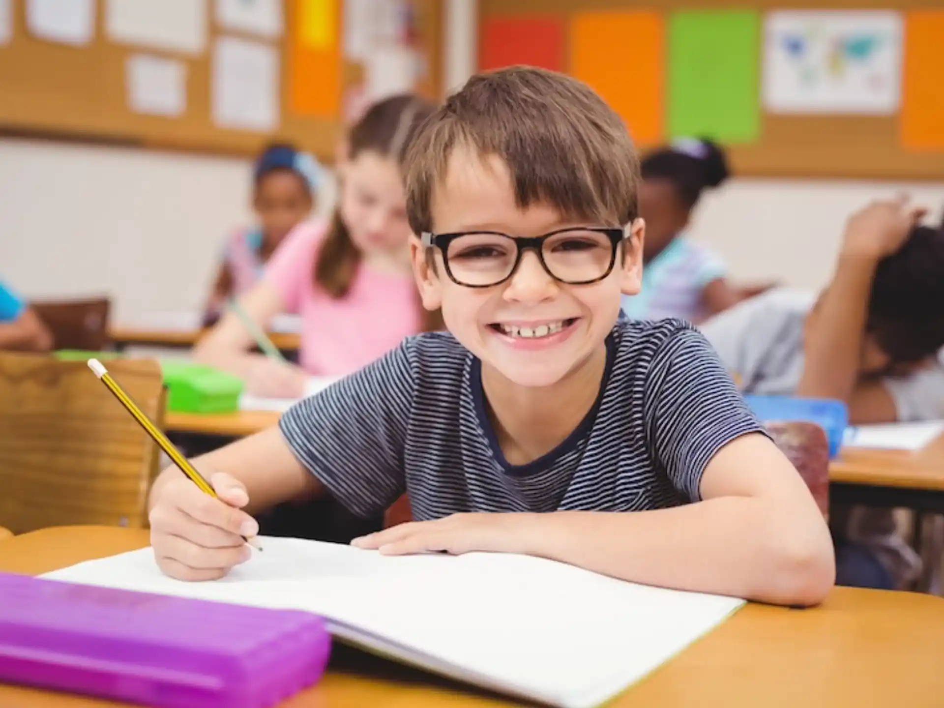 a boy sitting at a desk