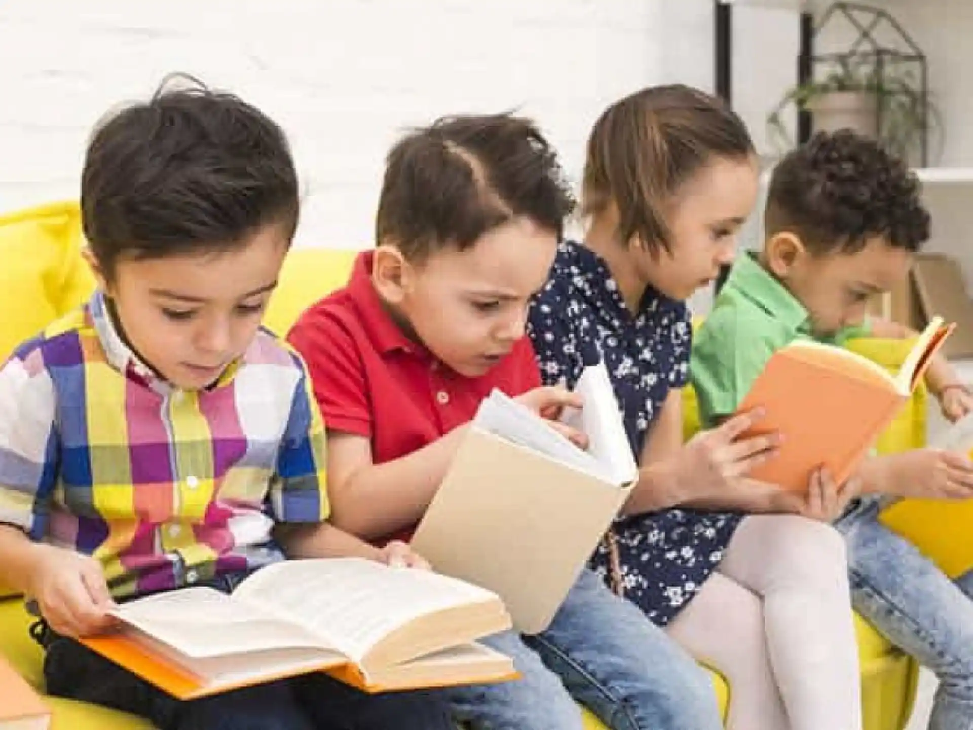a group of children reading books