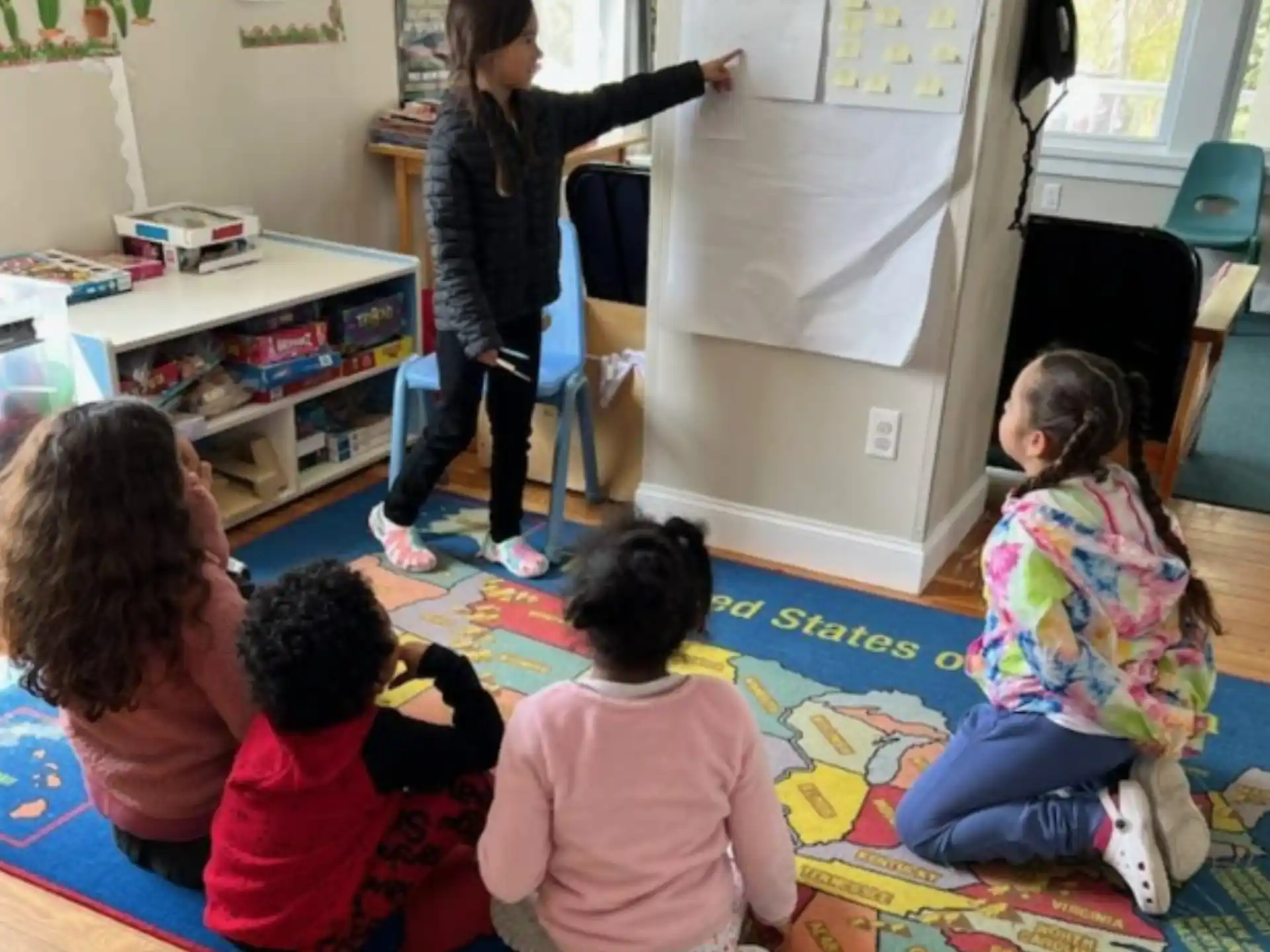 a person teaching children in a classroom