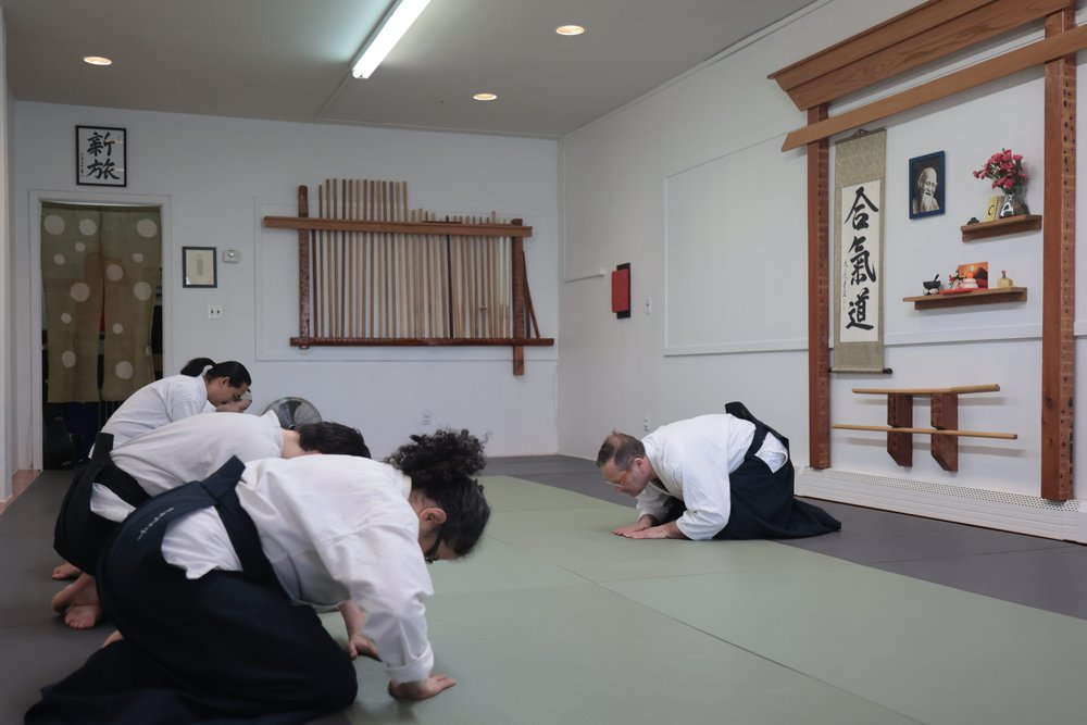 a group of people in karate uniforms