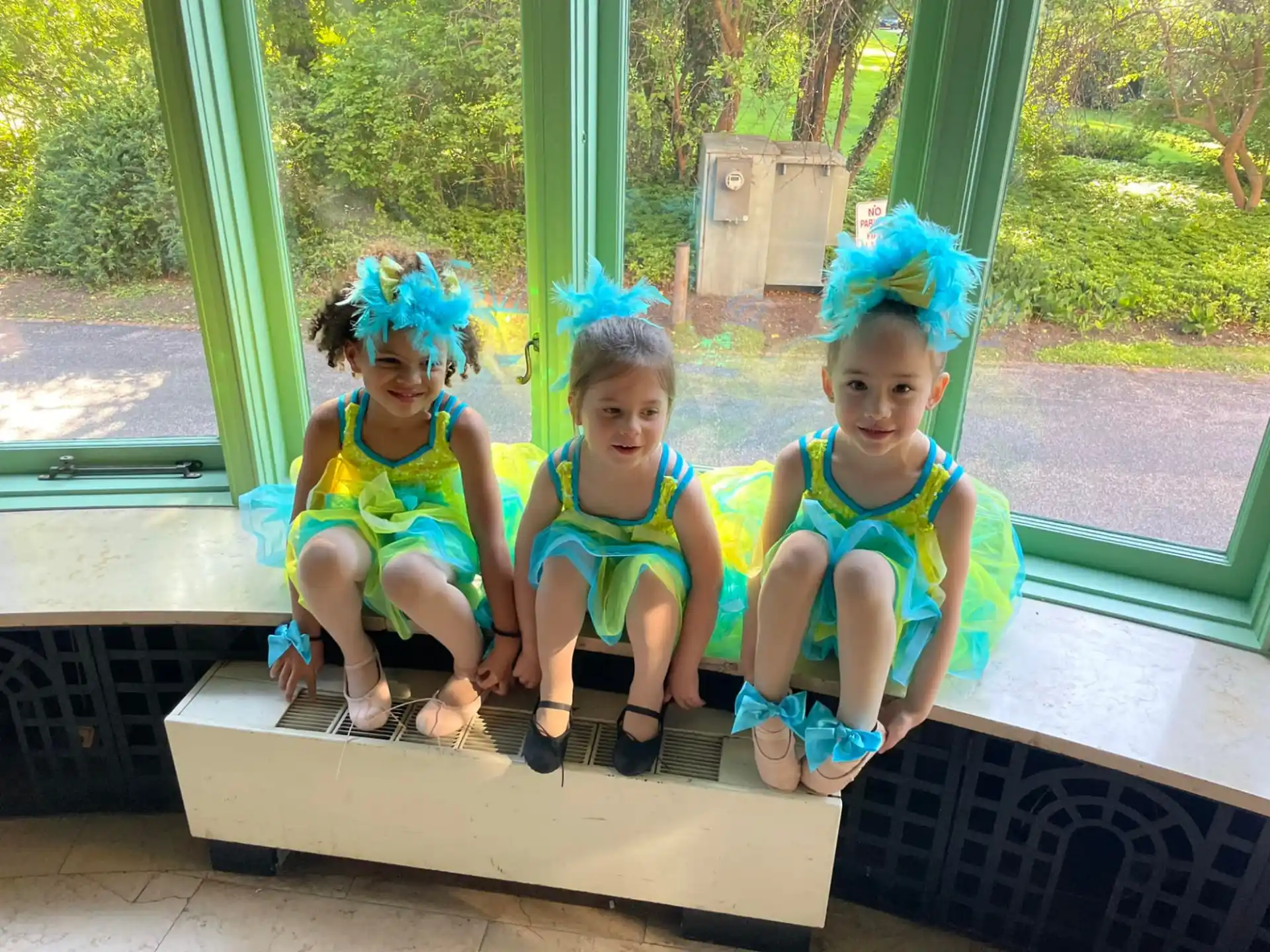 a group of children sitting on a bench