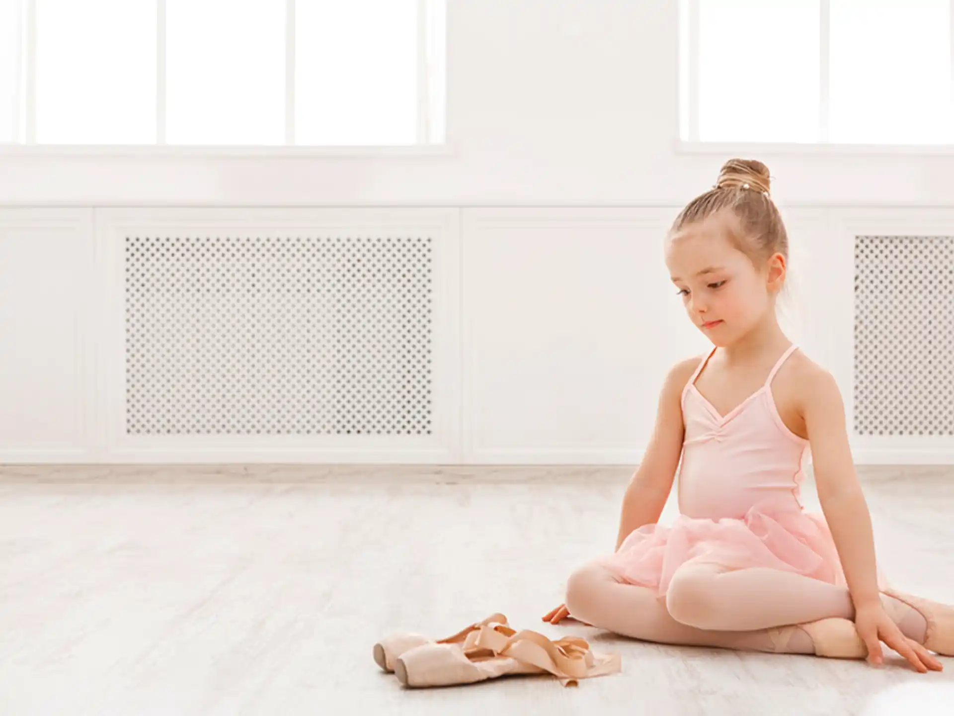 a girl sitting on the floor