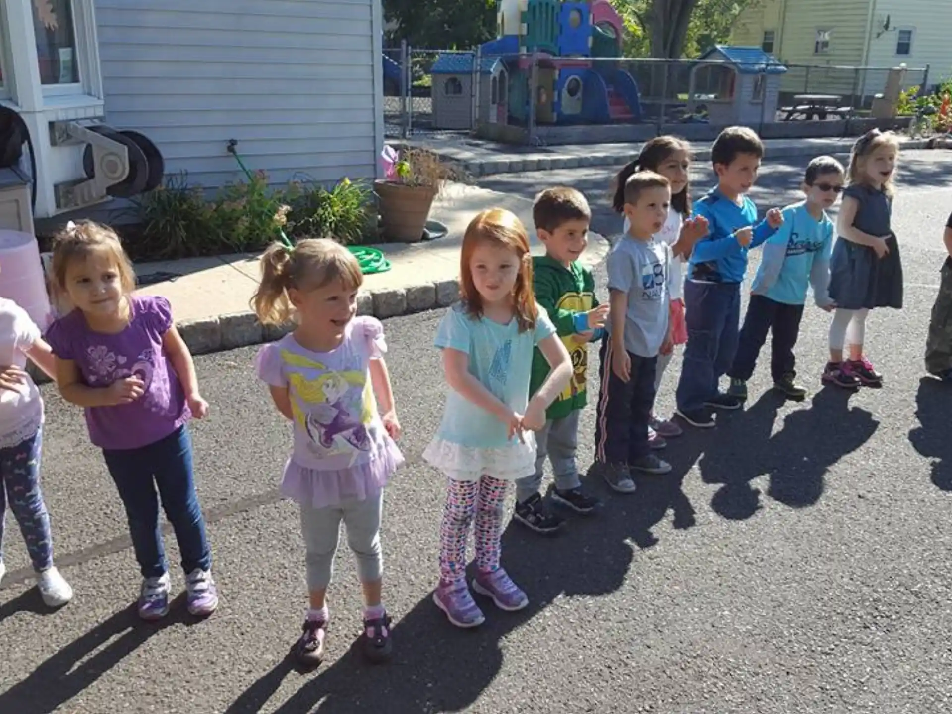 a group of children standing outside