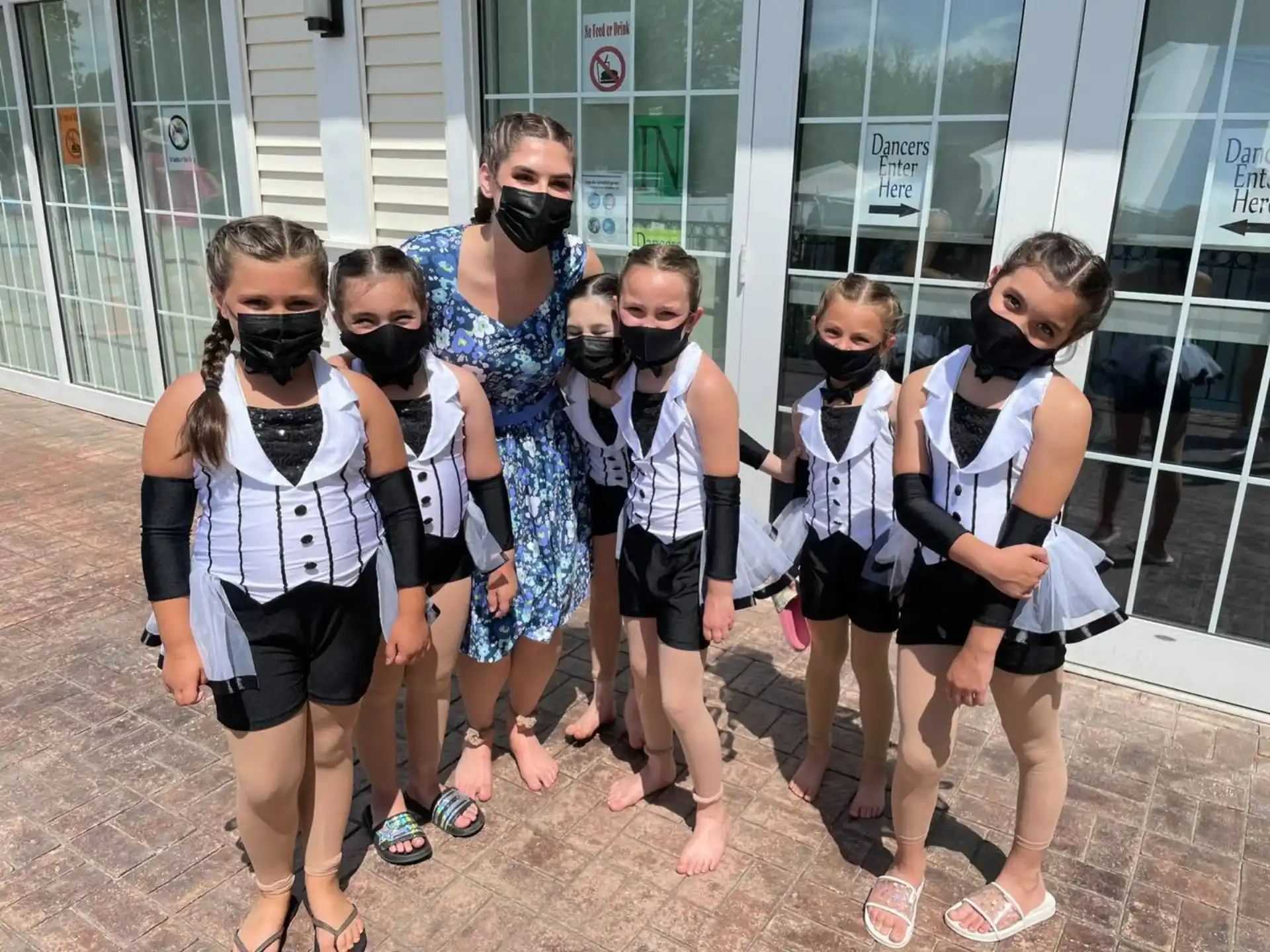 a group of people wearing masks
