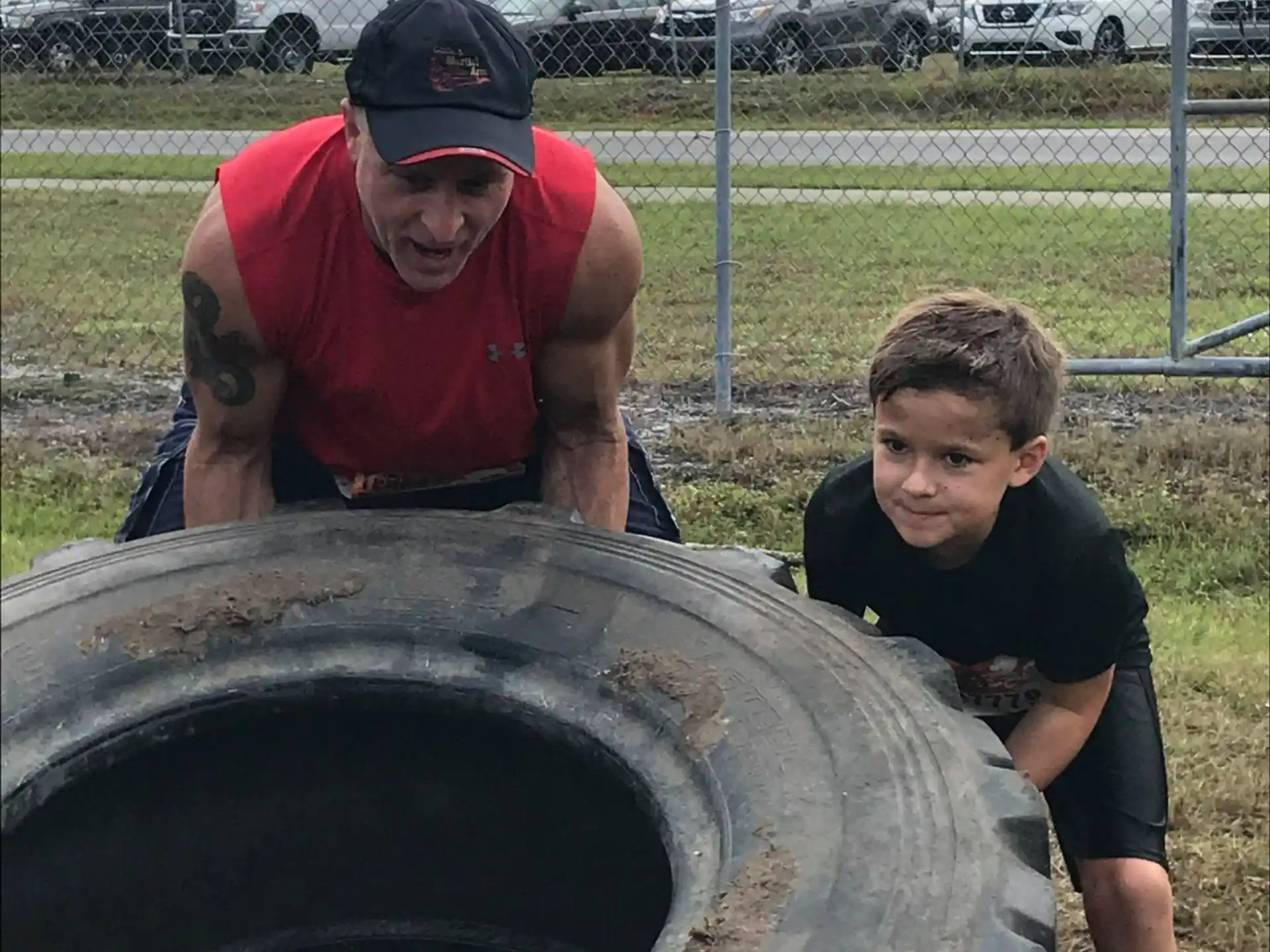 a man and a boy looking at a large metal object