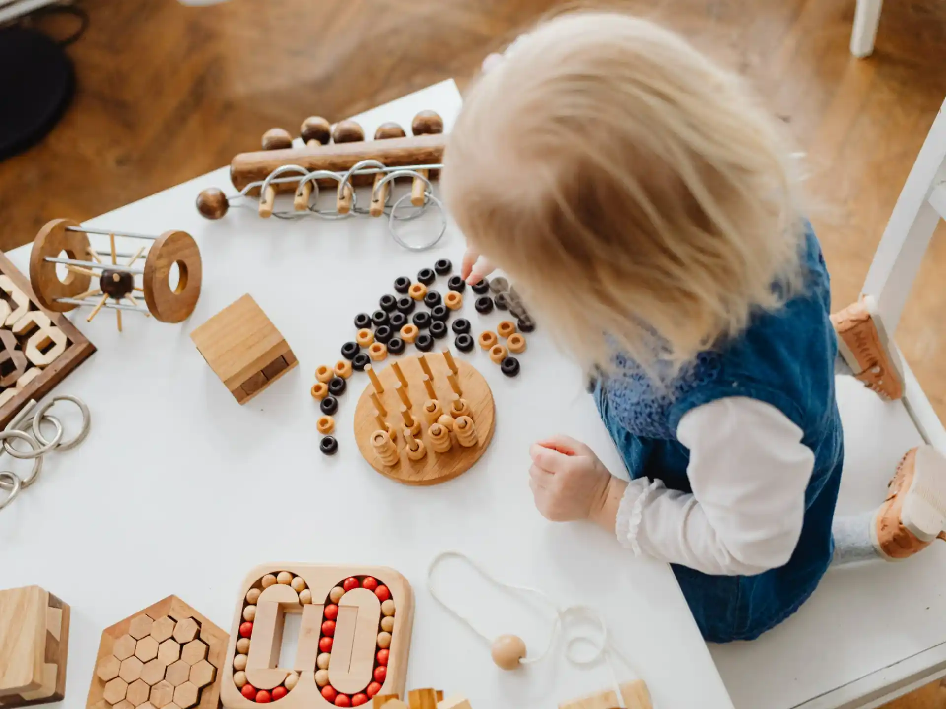 a child playing with wooden blocks