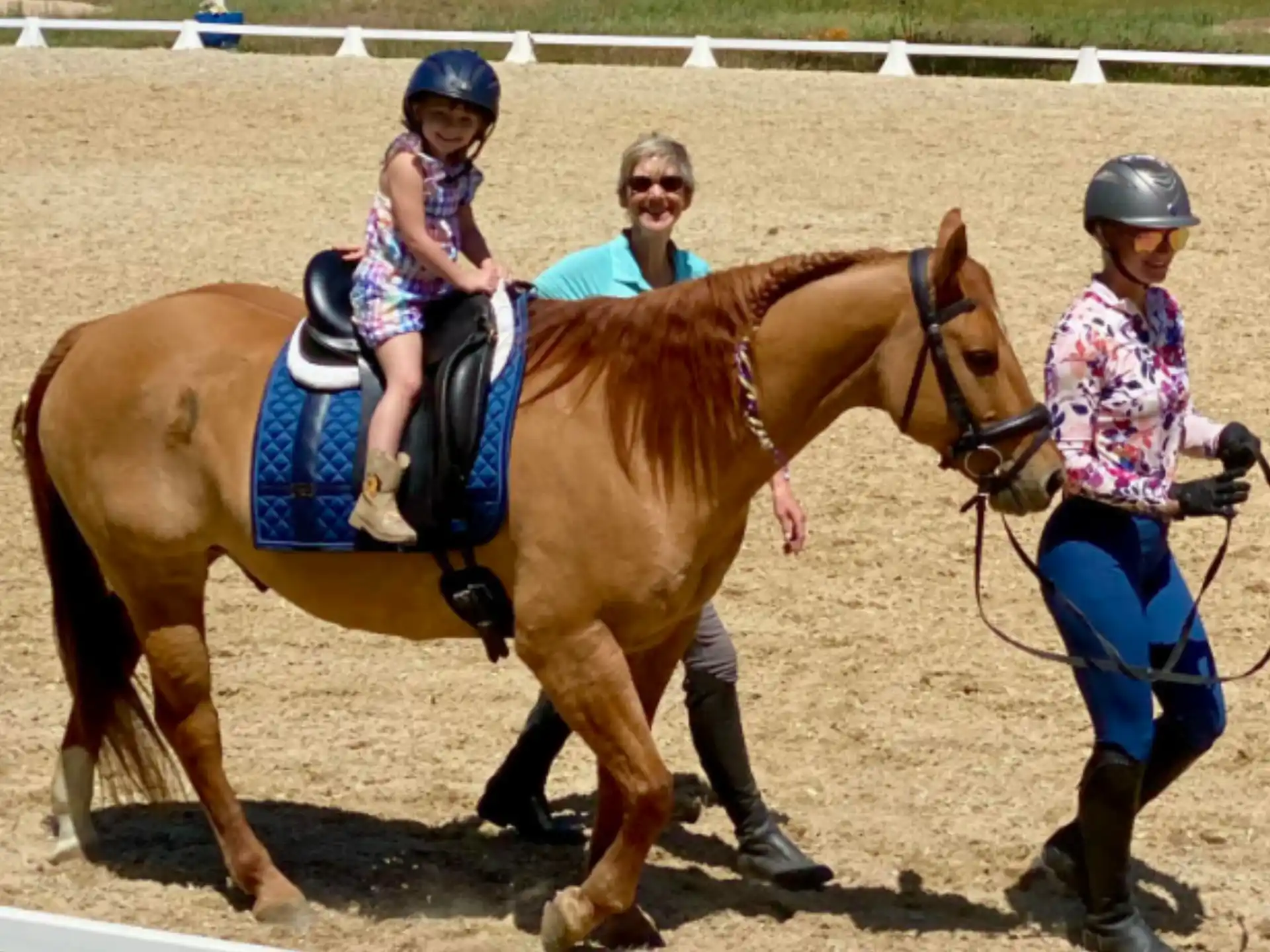 a group of people riding horses