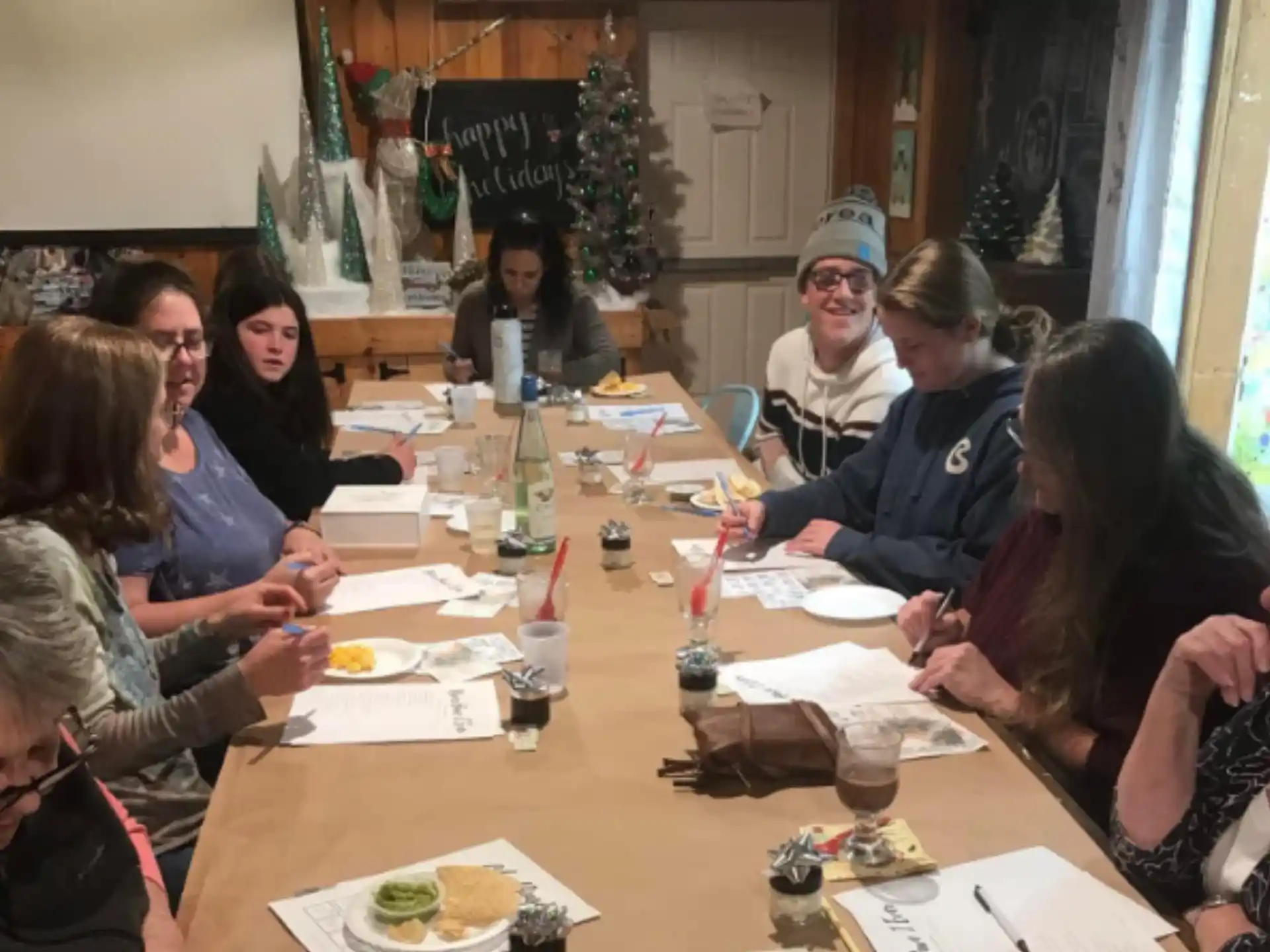 a group of people sitting around a table