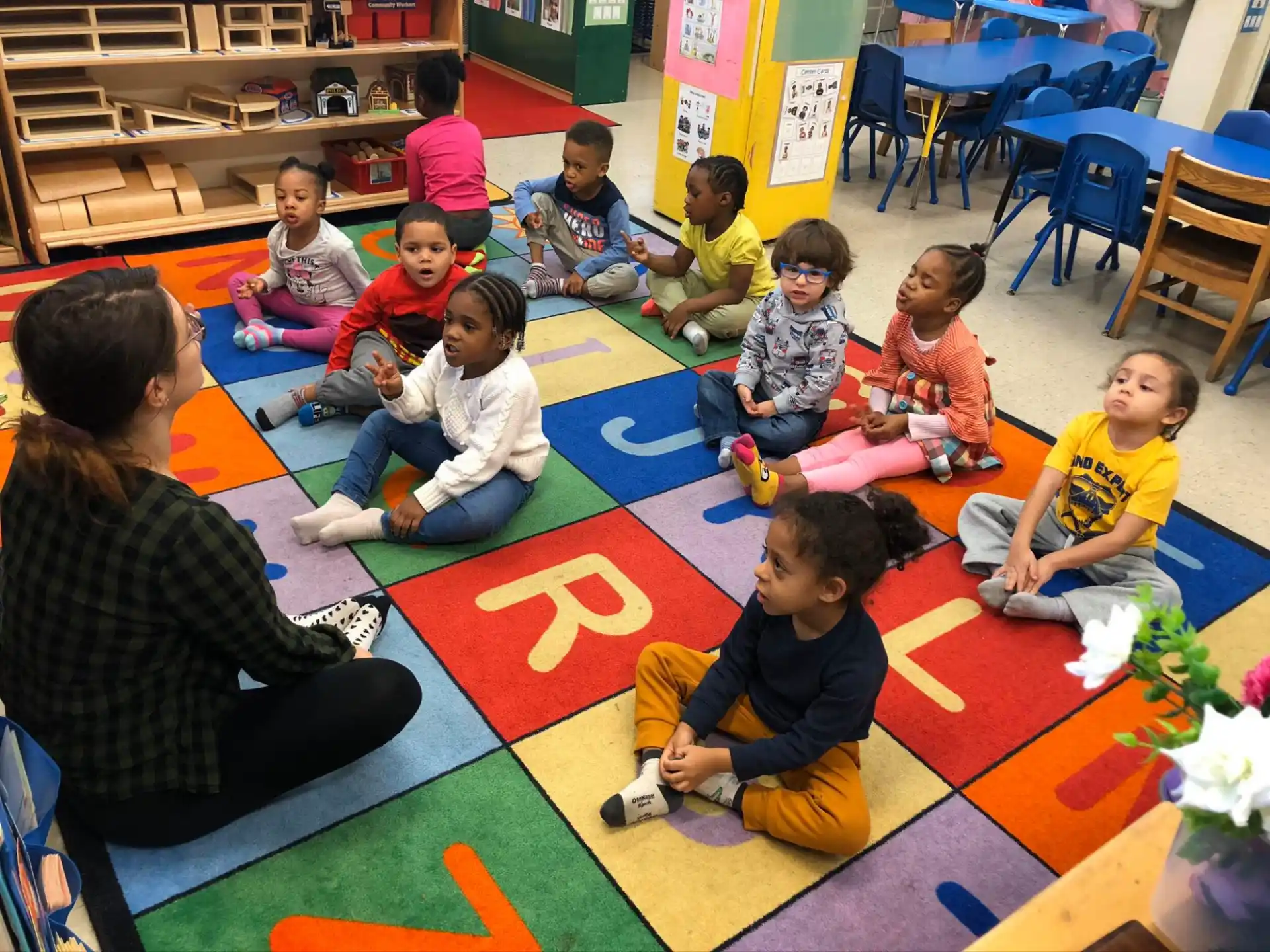 a group of children sitting on the floor