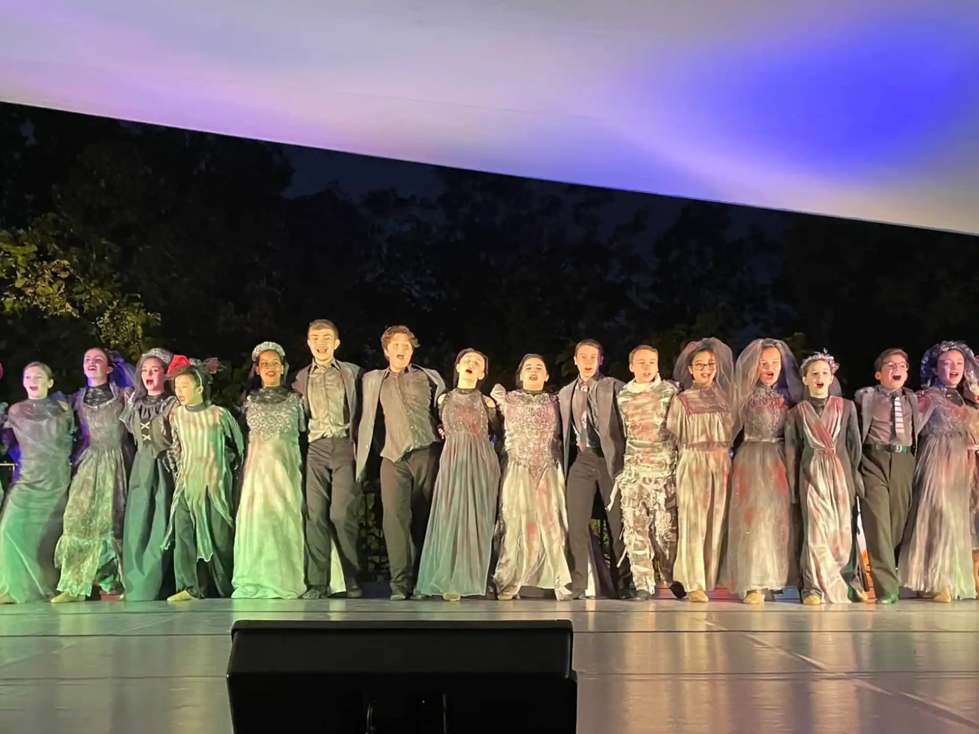 a group of people in clothing on a stage