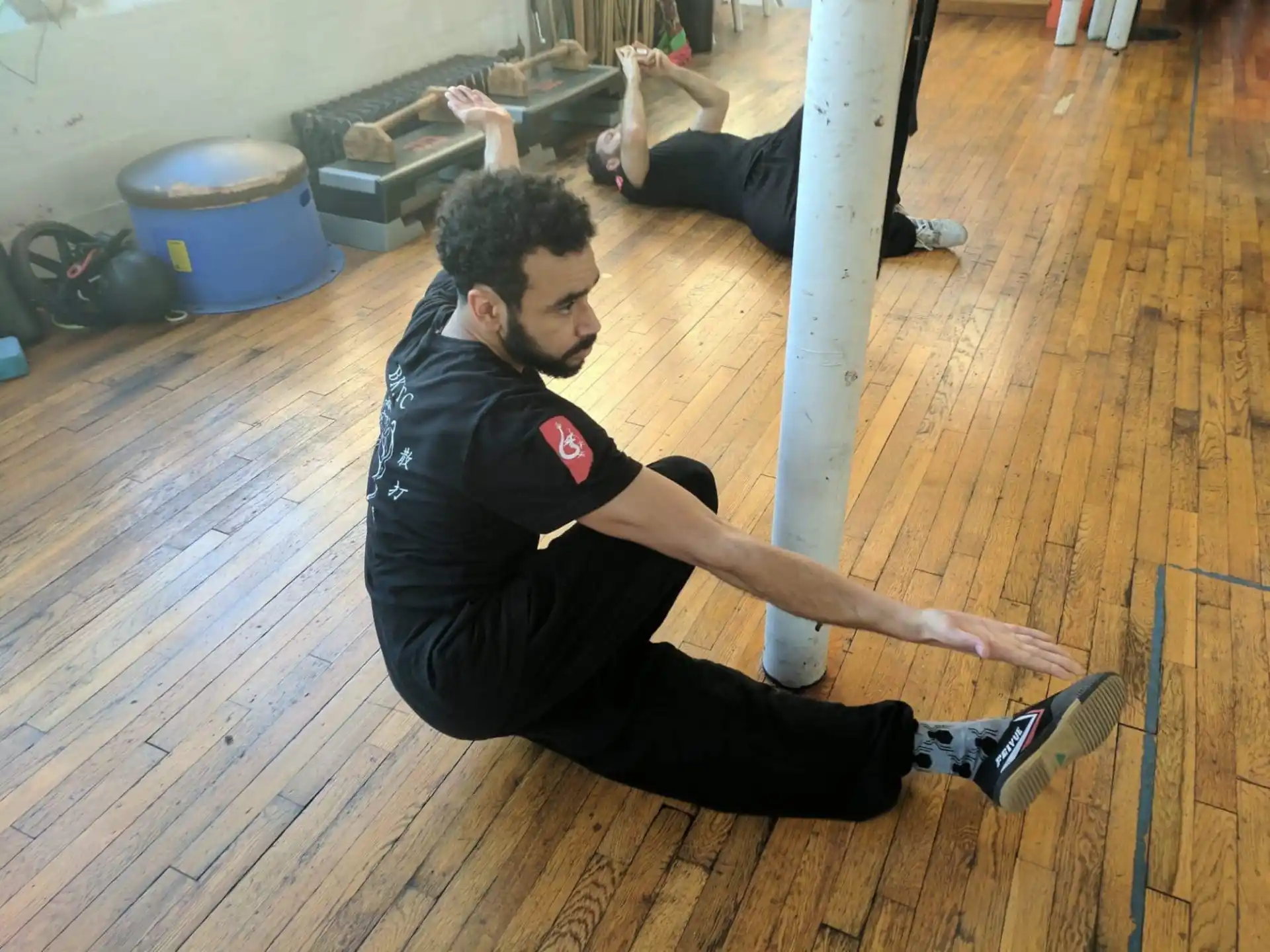 a person doing a plank on a wood floor