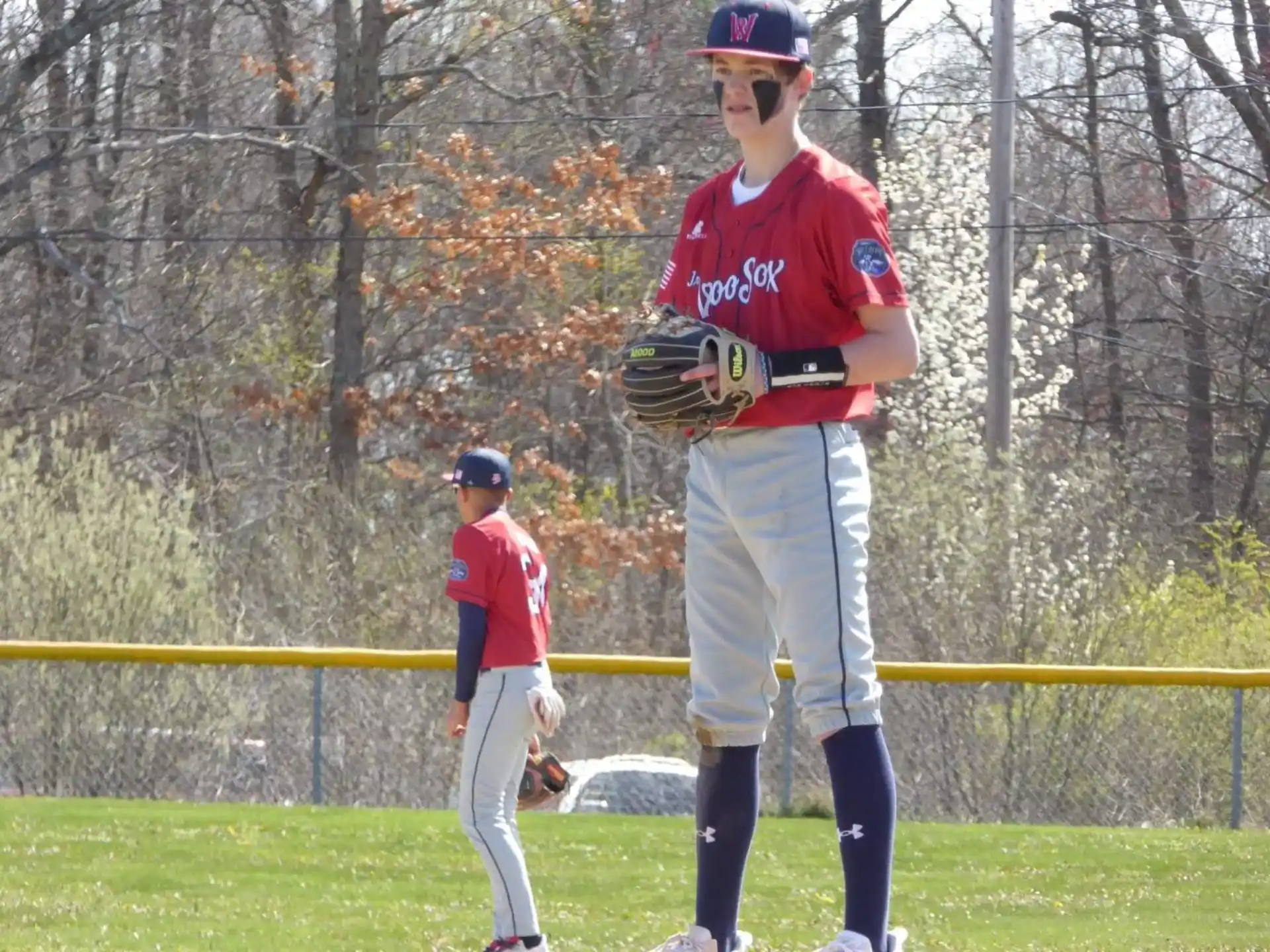 a baseball player holding a baseball