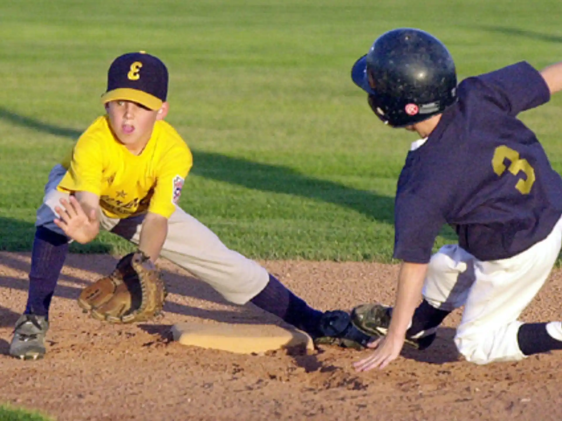 a couple of kids playing baseball