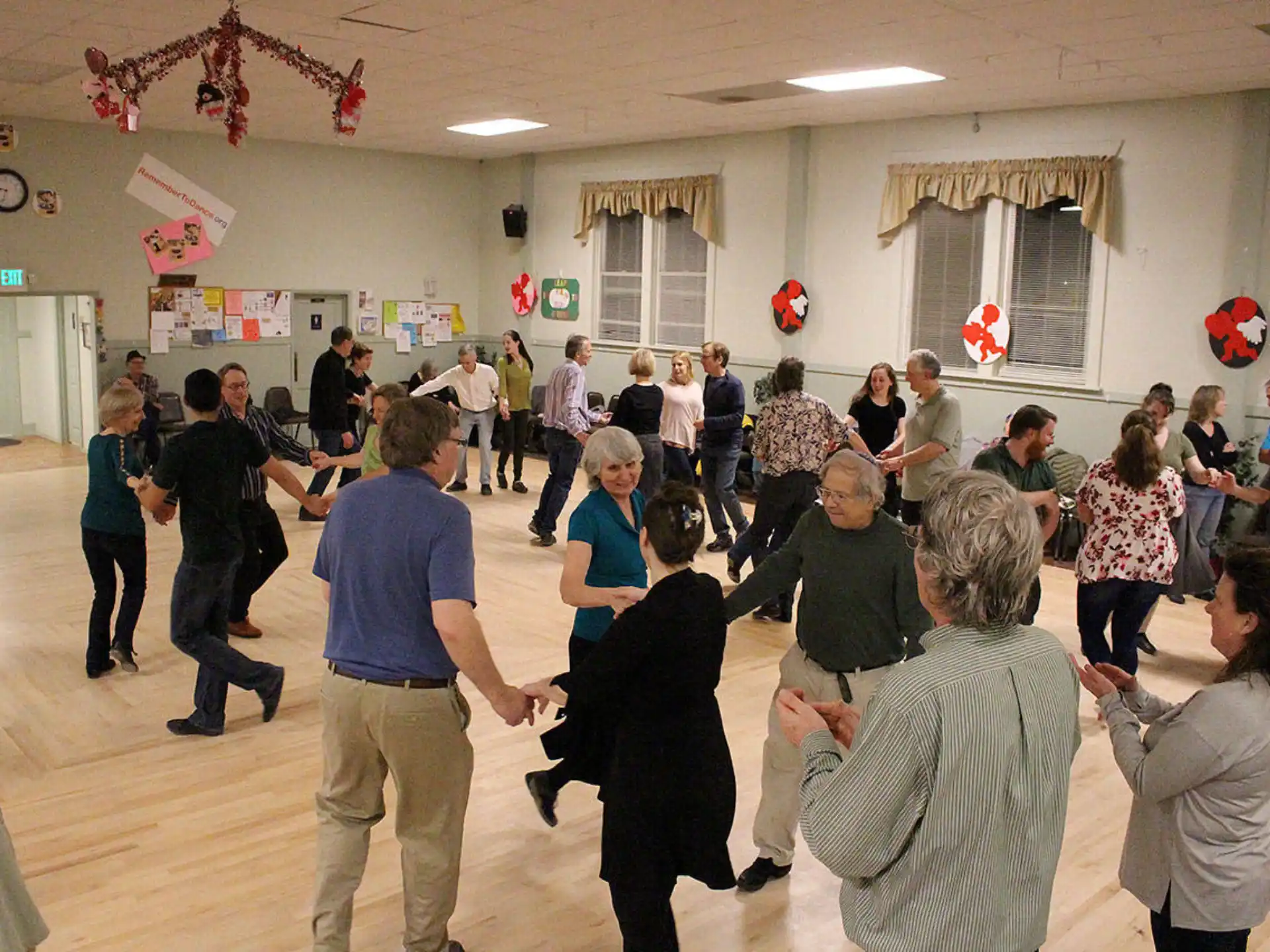 a group of people dancing in a room