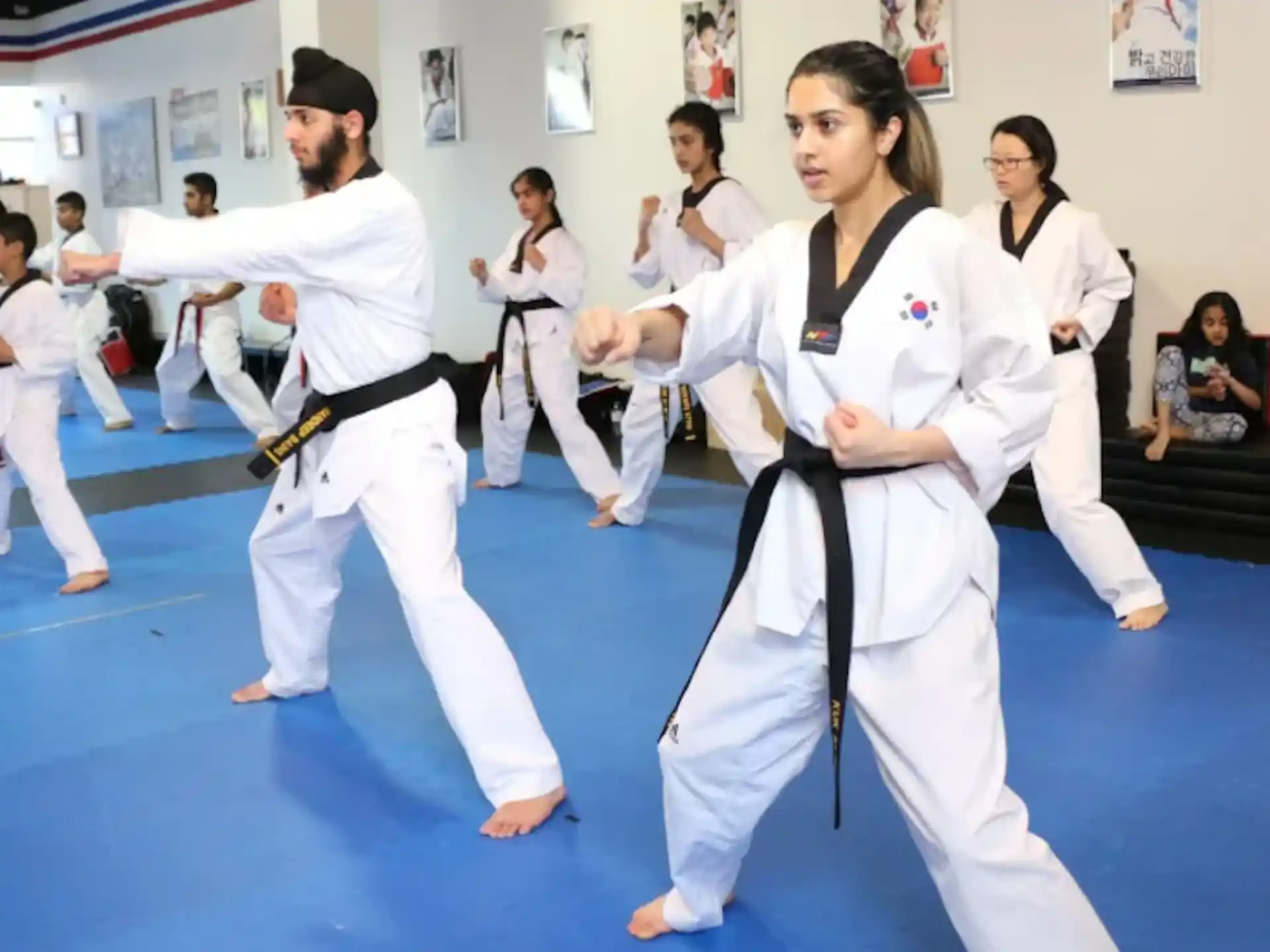 a group of people in karate uniforms