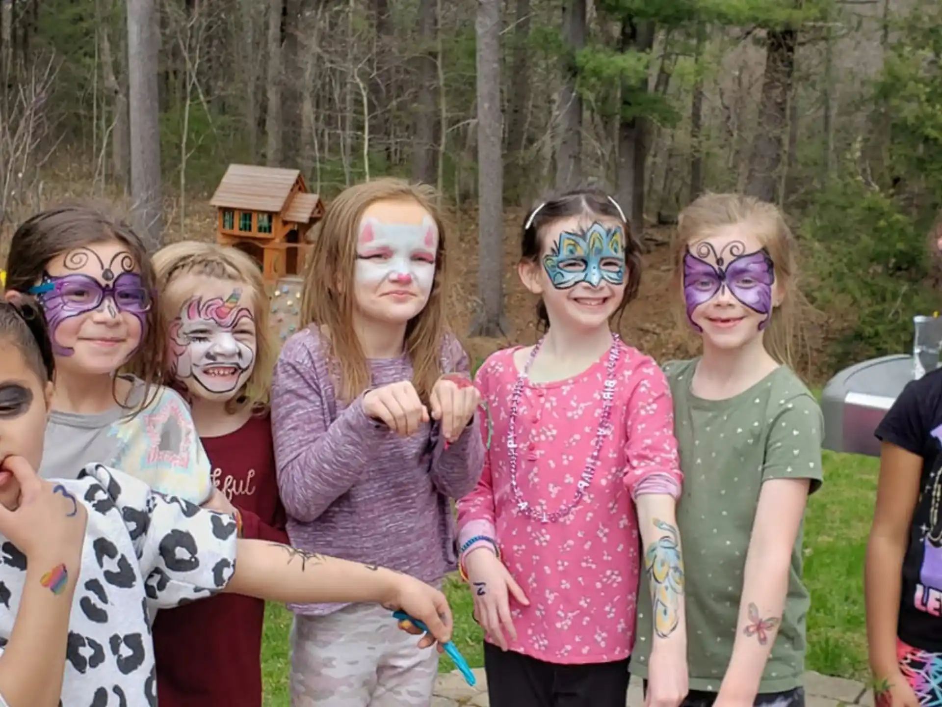 a group of children with paint on their faces