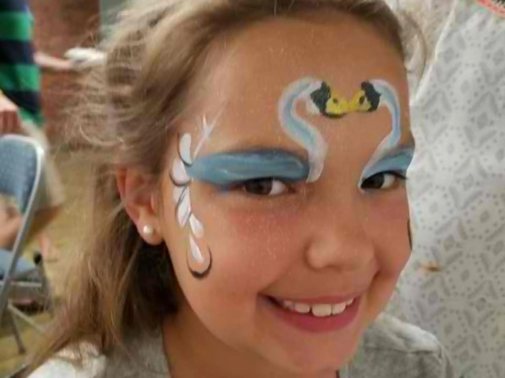 a person with blue paint on the face