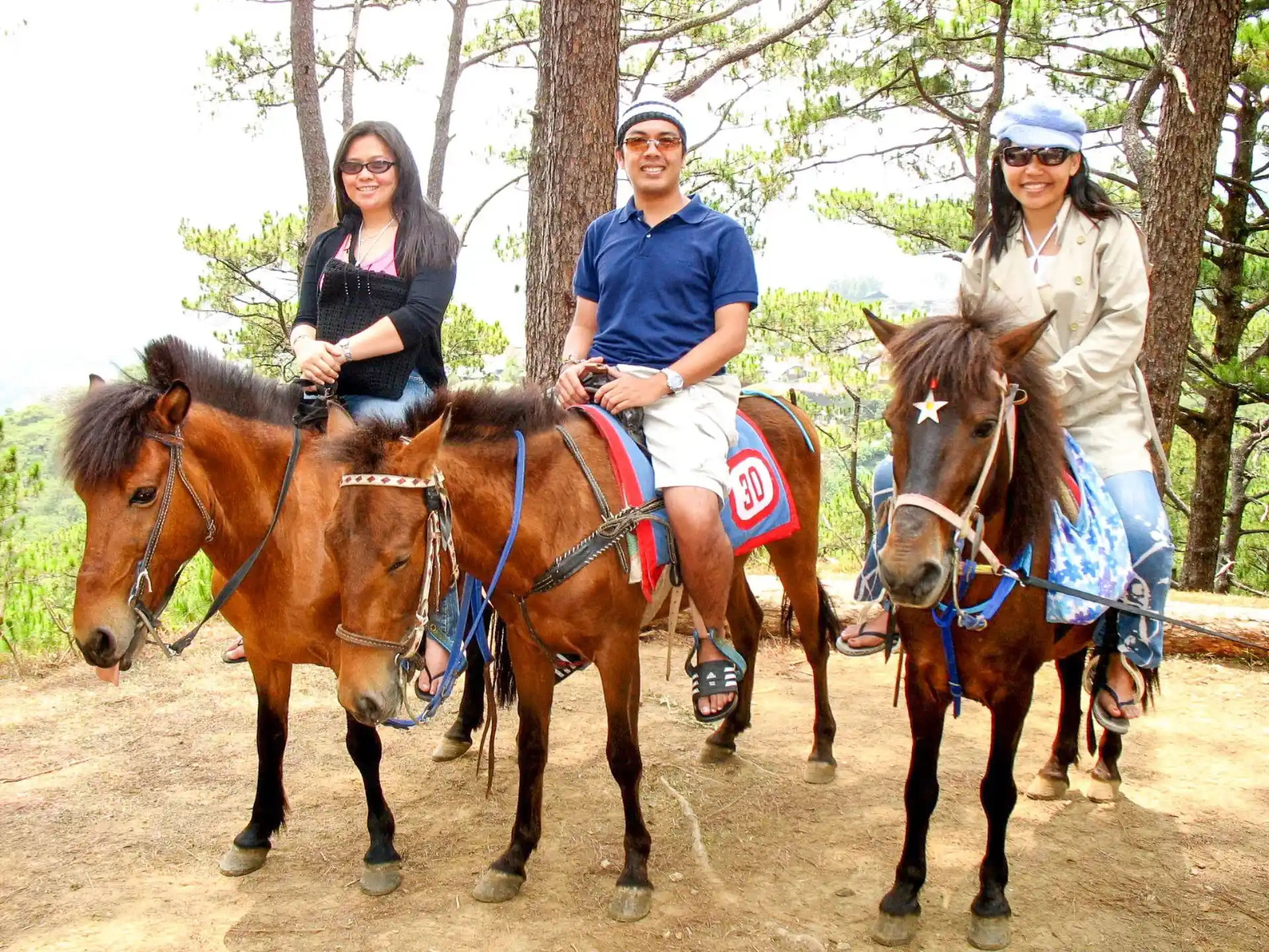 a group of people riding horses