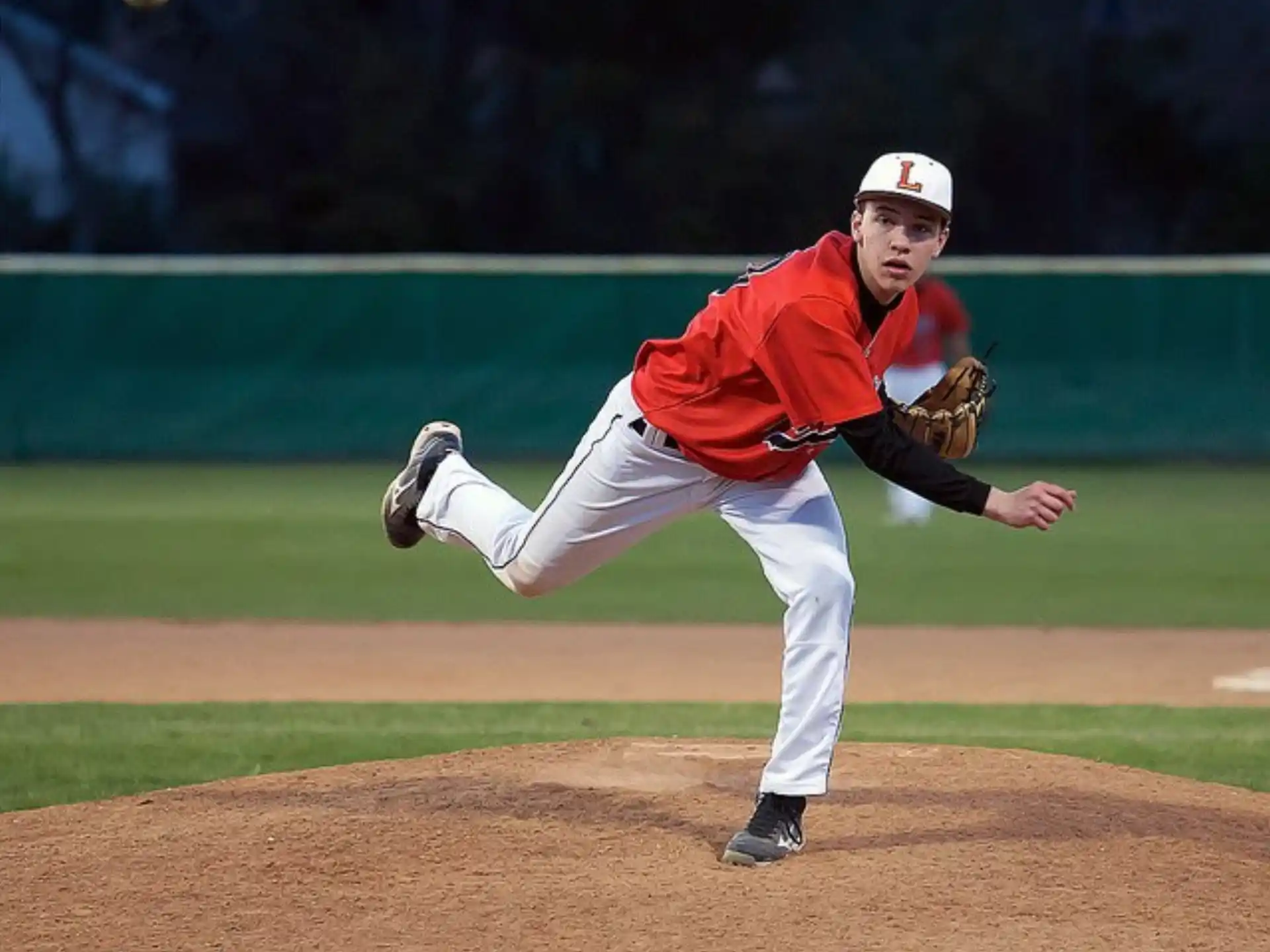 a baseball player throwing a ball