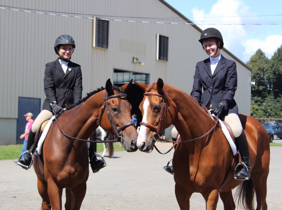 a group of people ride on horses