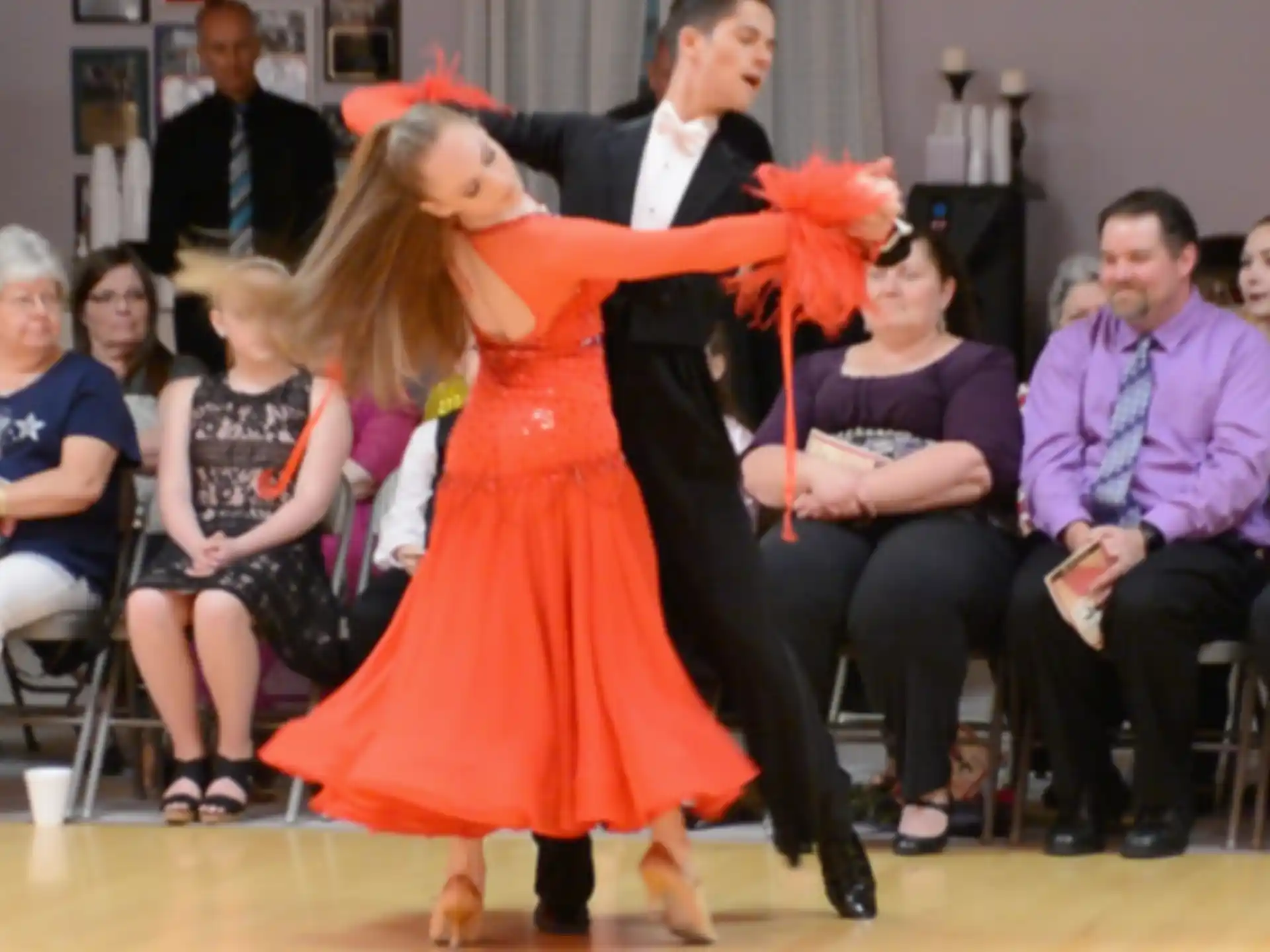 a girl dancing in a red dress