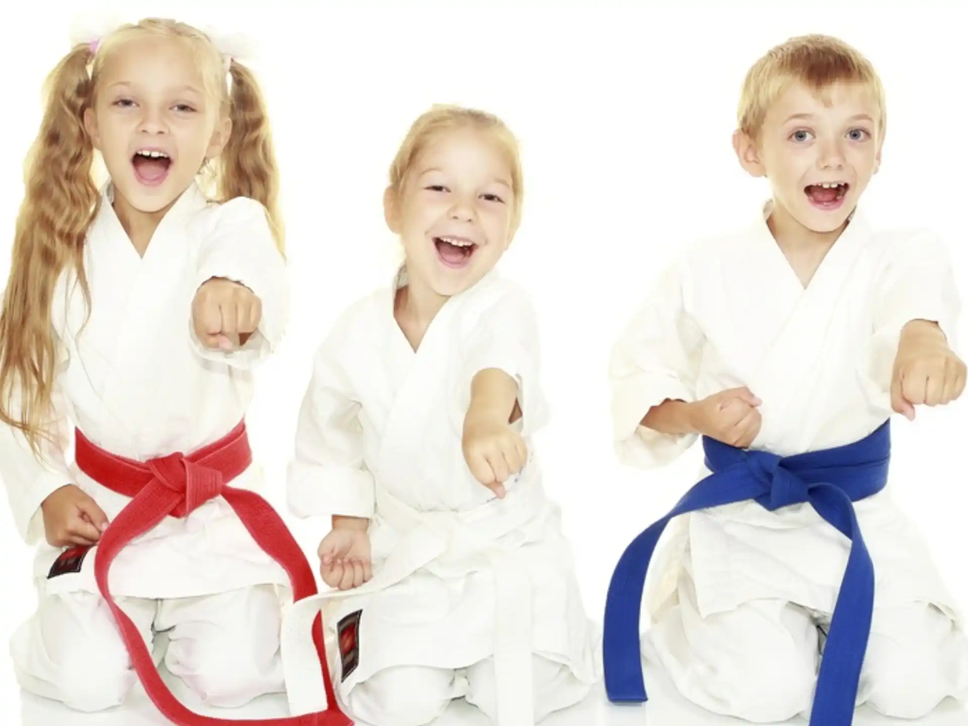 a group of children in white clothes
