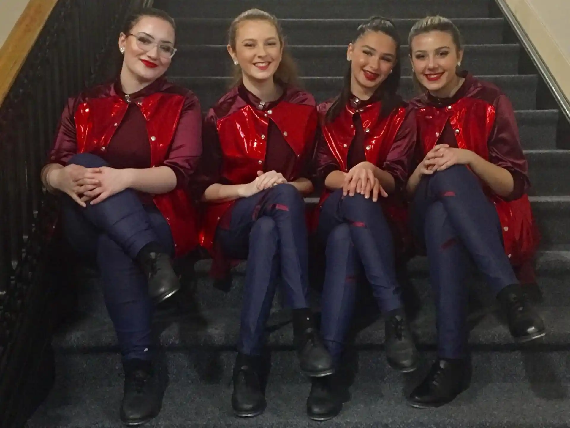 a group of people sitting on stairs