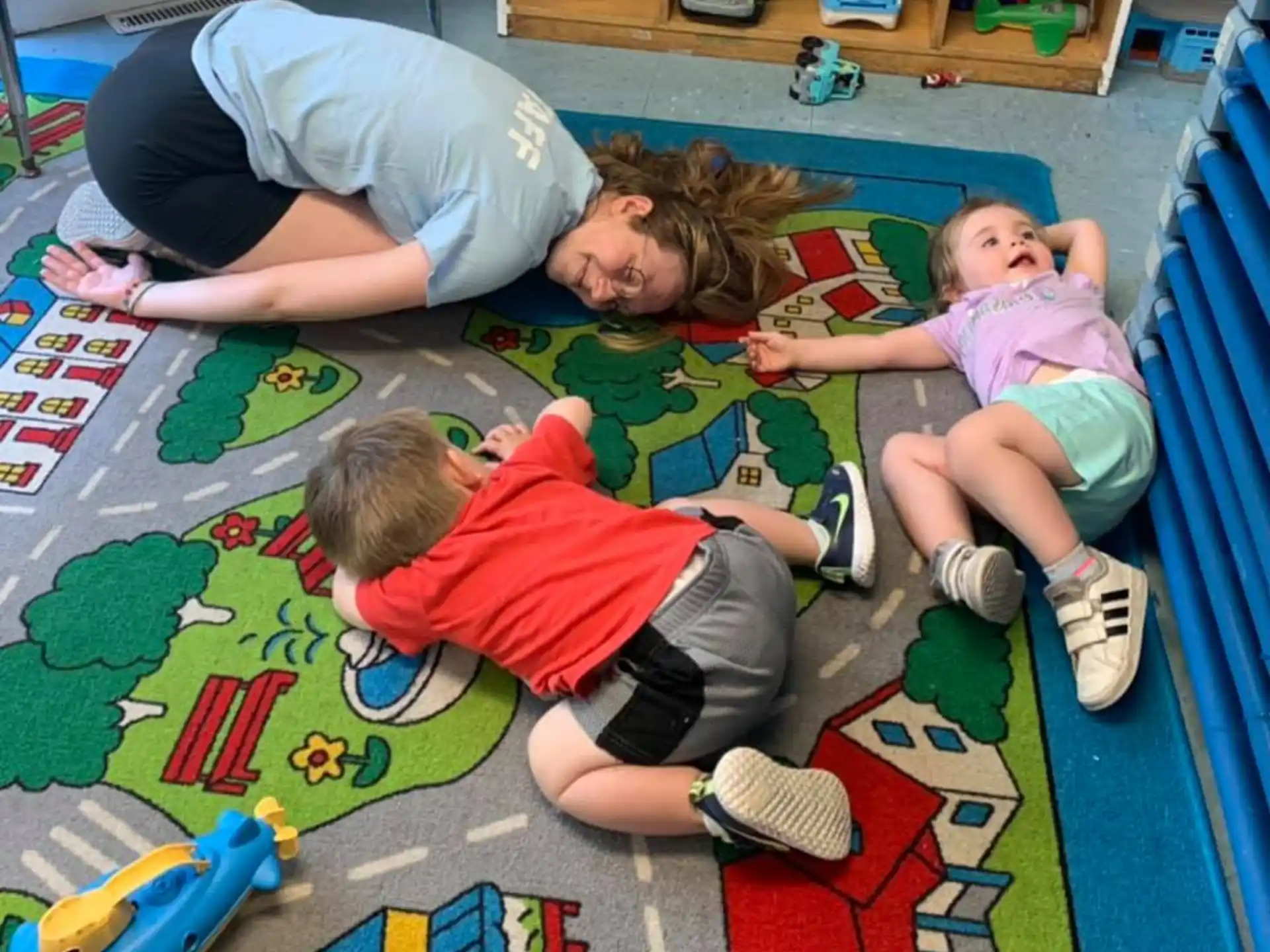 a group of children playing on the floor
