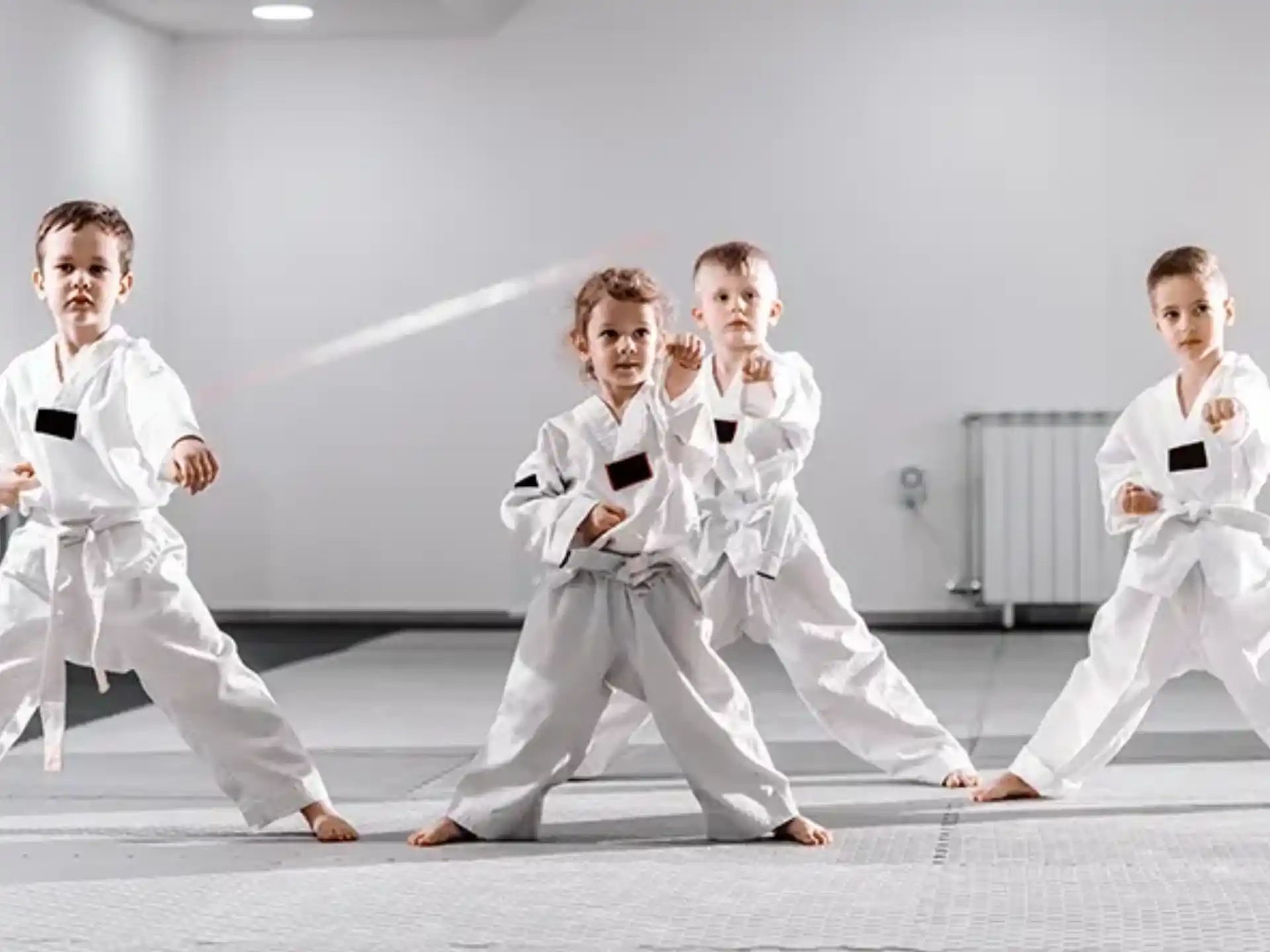 a group of people in karate uniforms