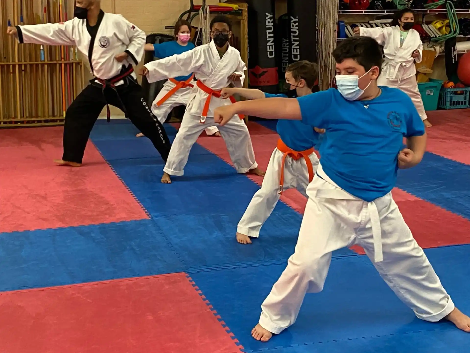a group of people in karate uniforms