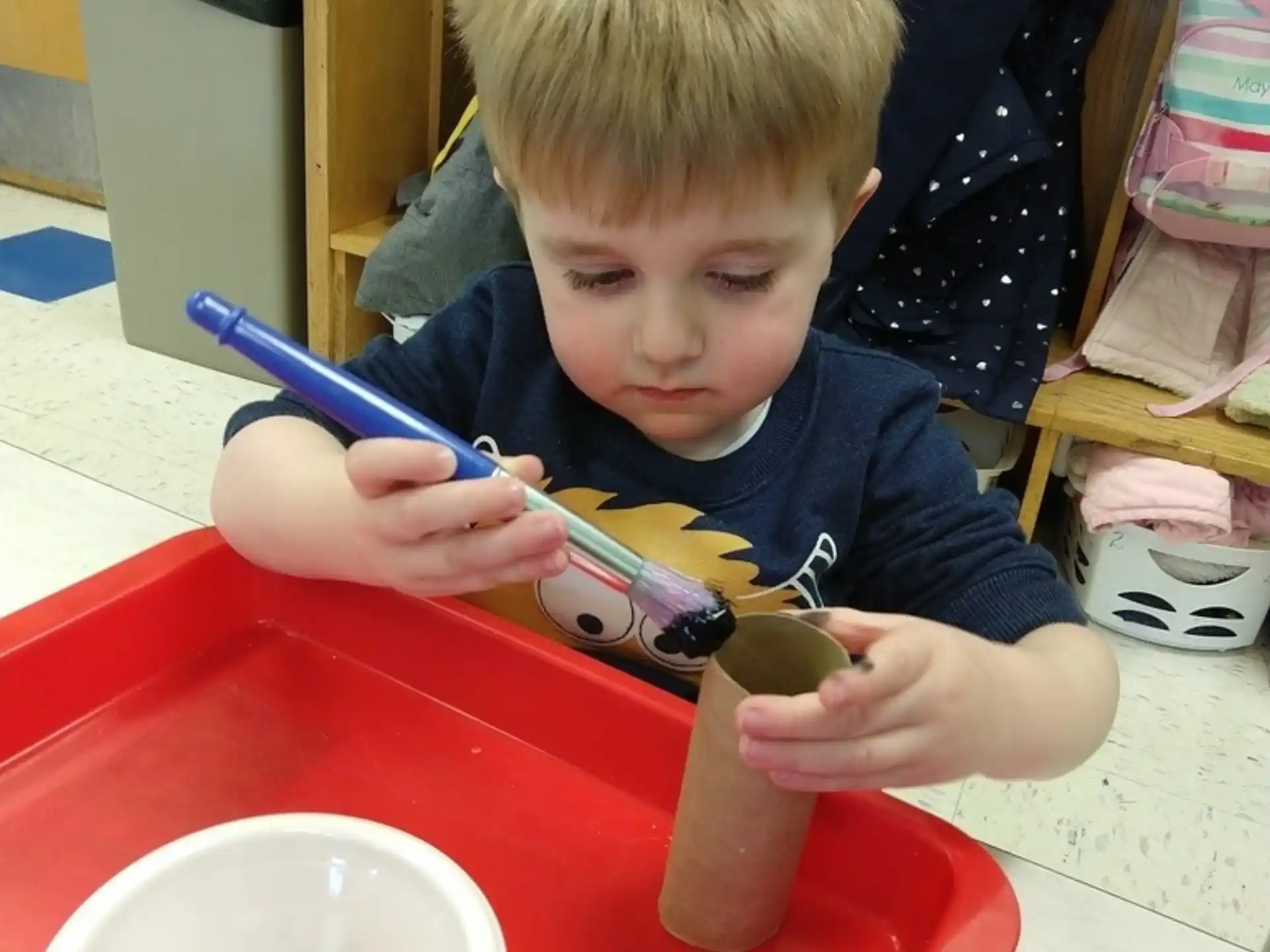 a boy eating from a bowl