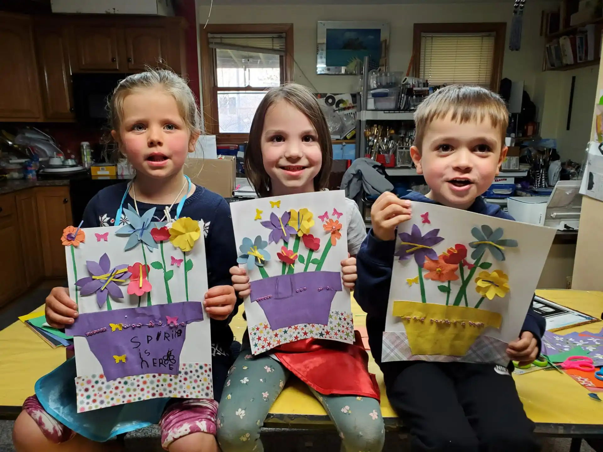a group of children holding gift bags