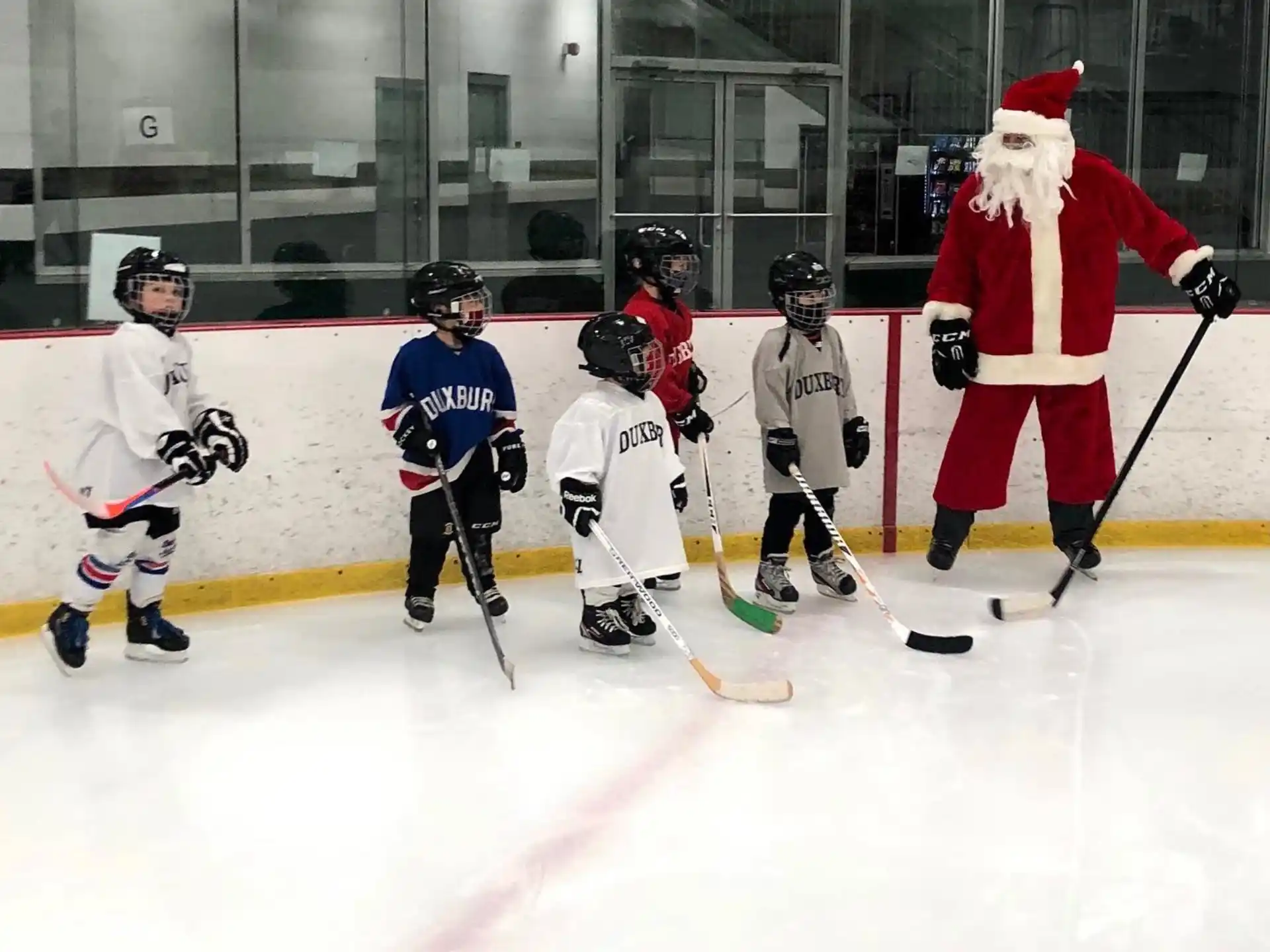 a group of people playing hockey