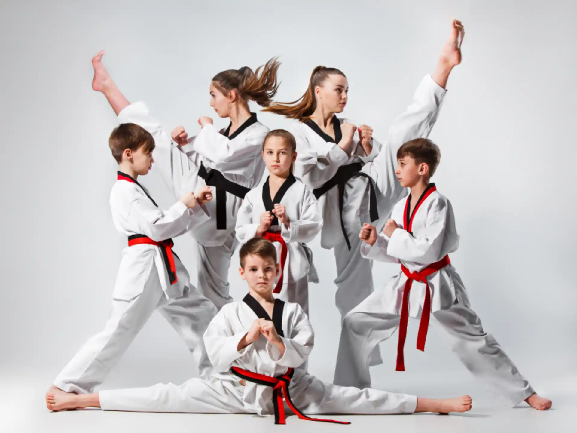 a group of people in karate uniforms