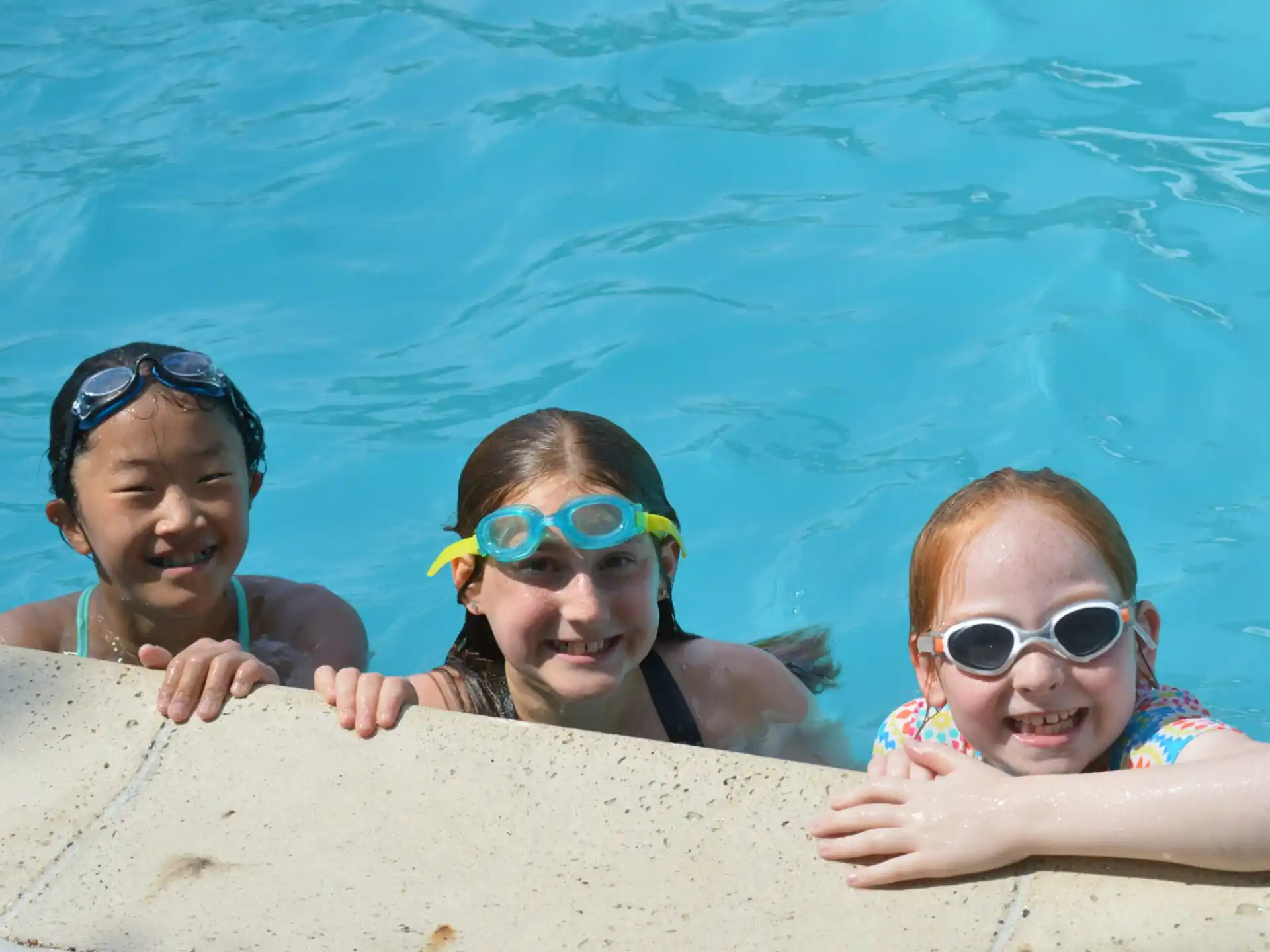 a group of kids in a pool