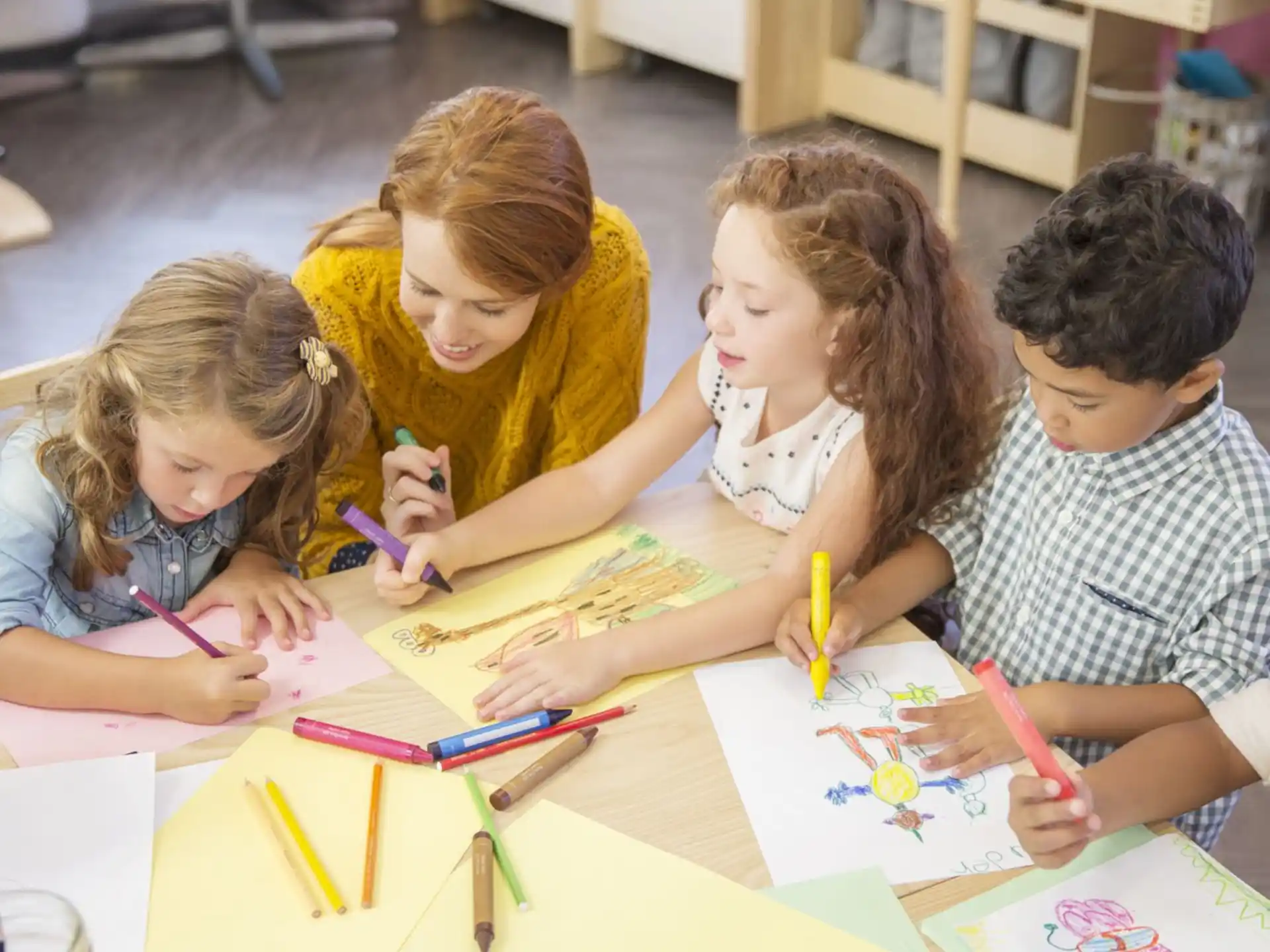 a group of children sitting at a table