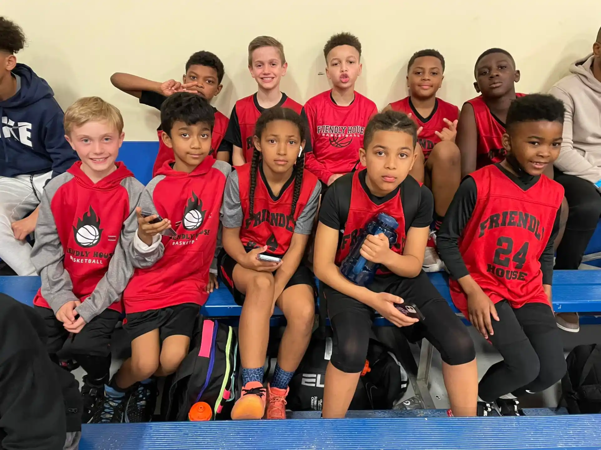 a group of boys in red shirts