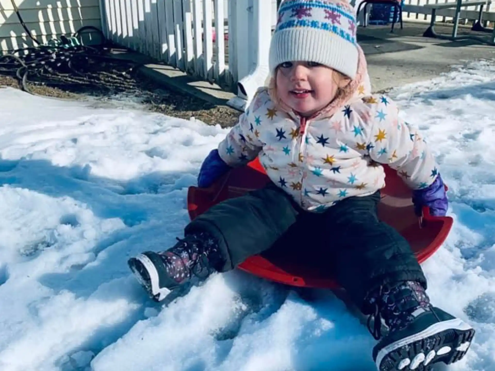a child sitting in the snow