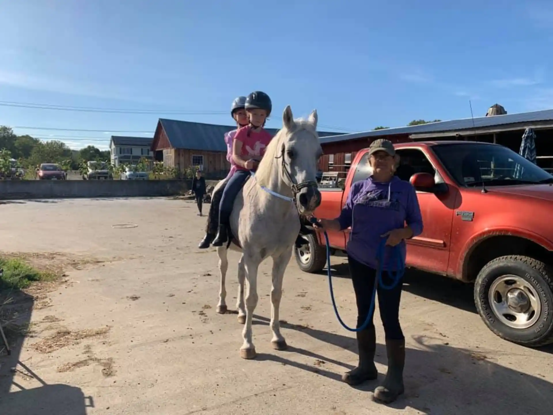 a person on a horse next to a person on a horse