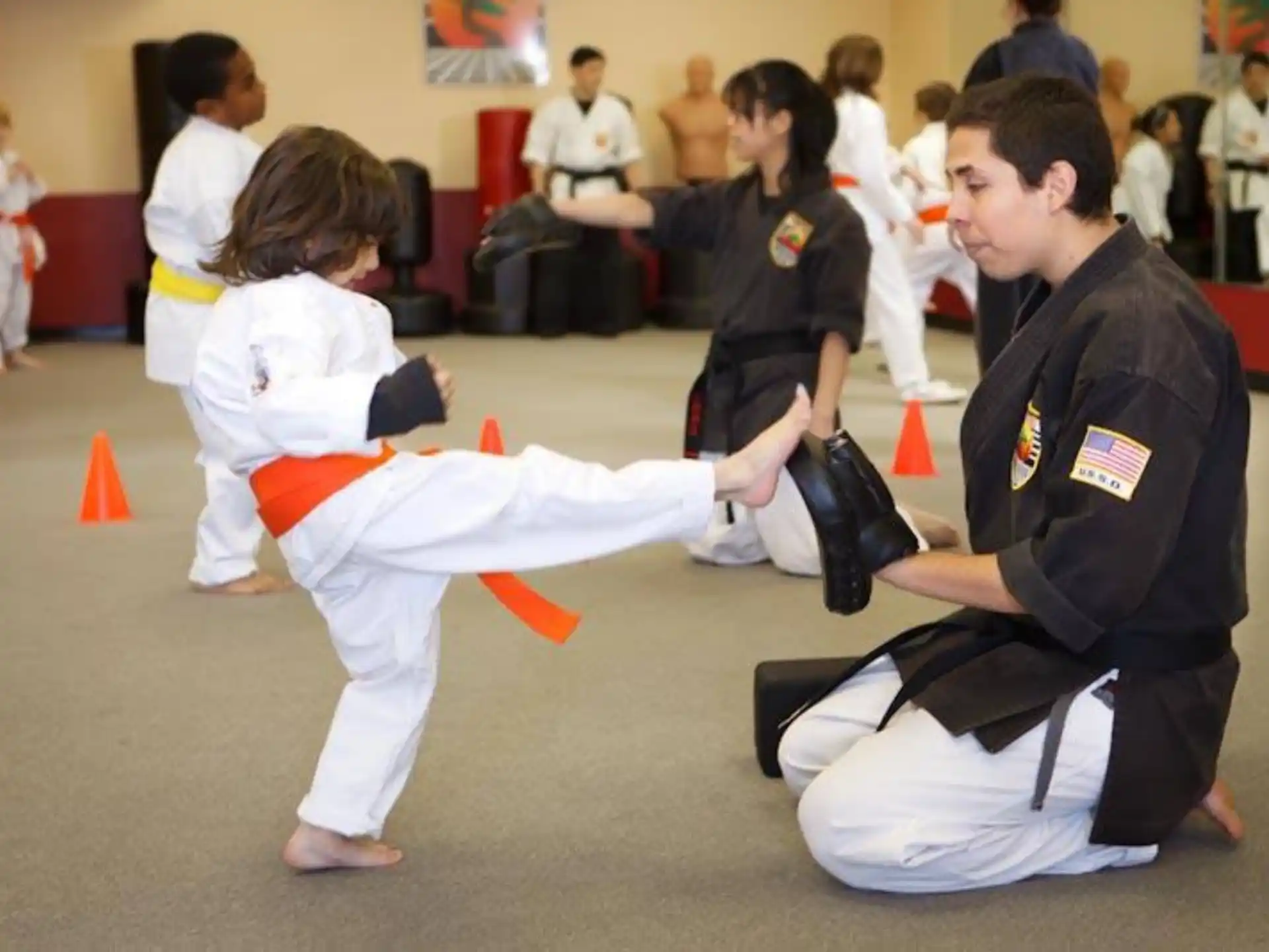 a man and a woman in karate uniforms