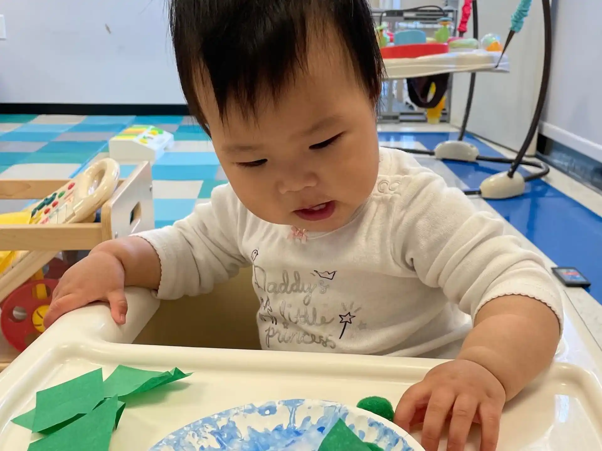 a child painting on a table
