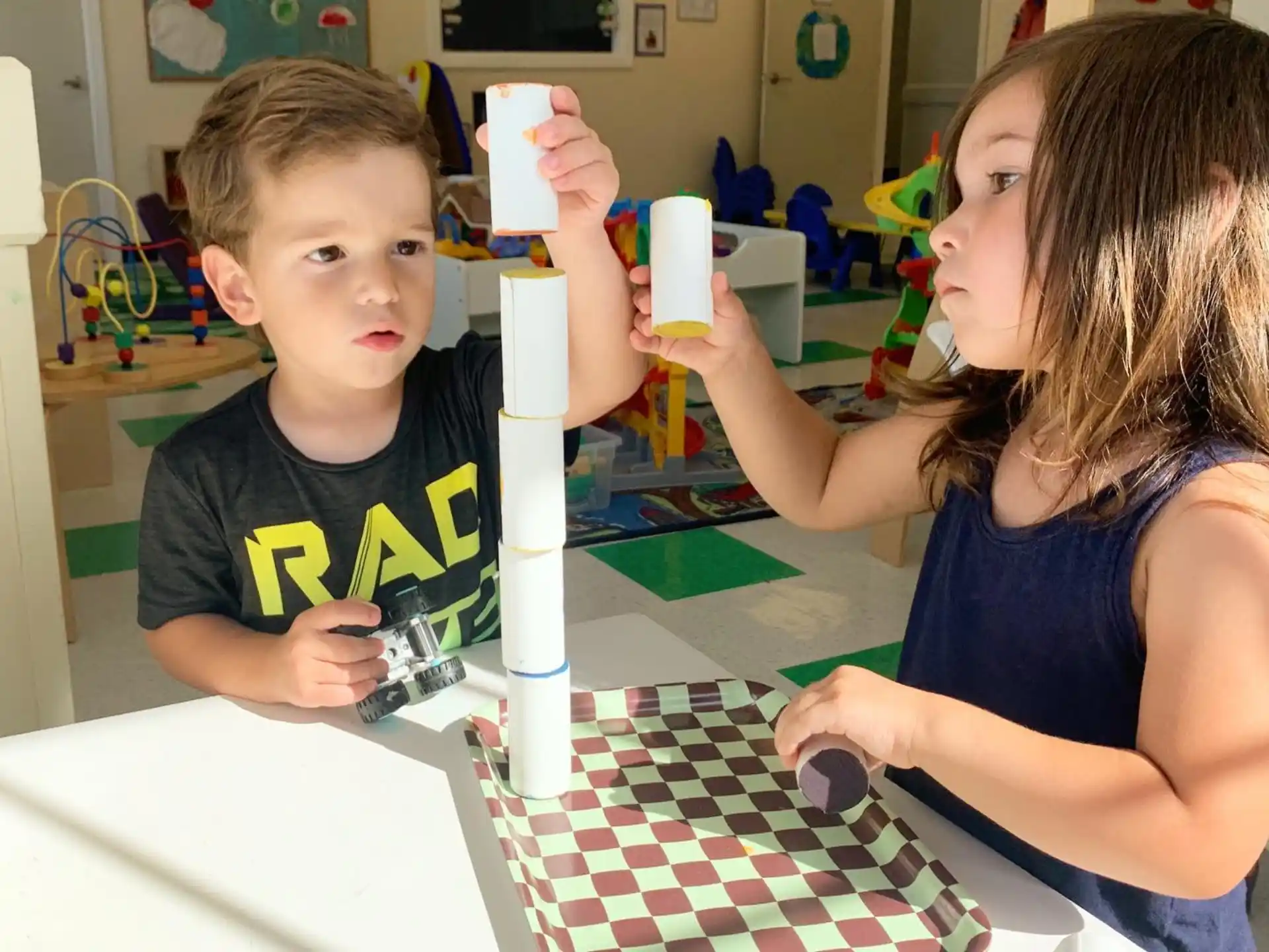 a person and a boy holding a white object