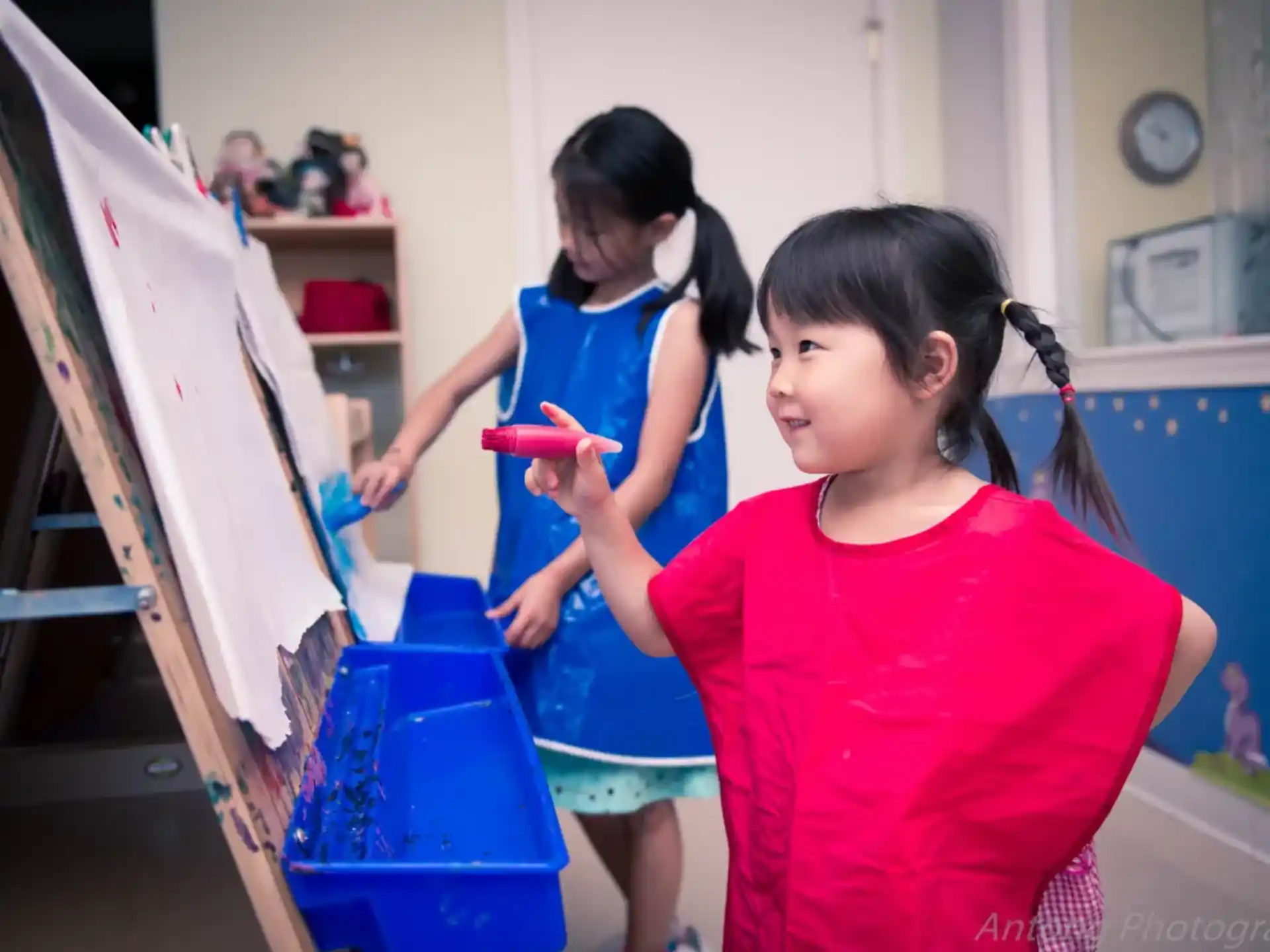 a few young girls in a room