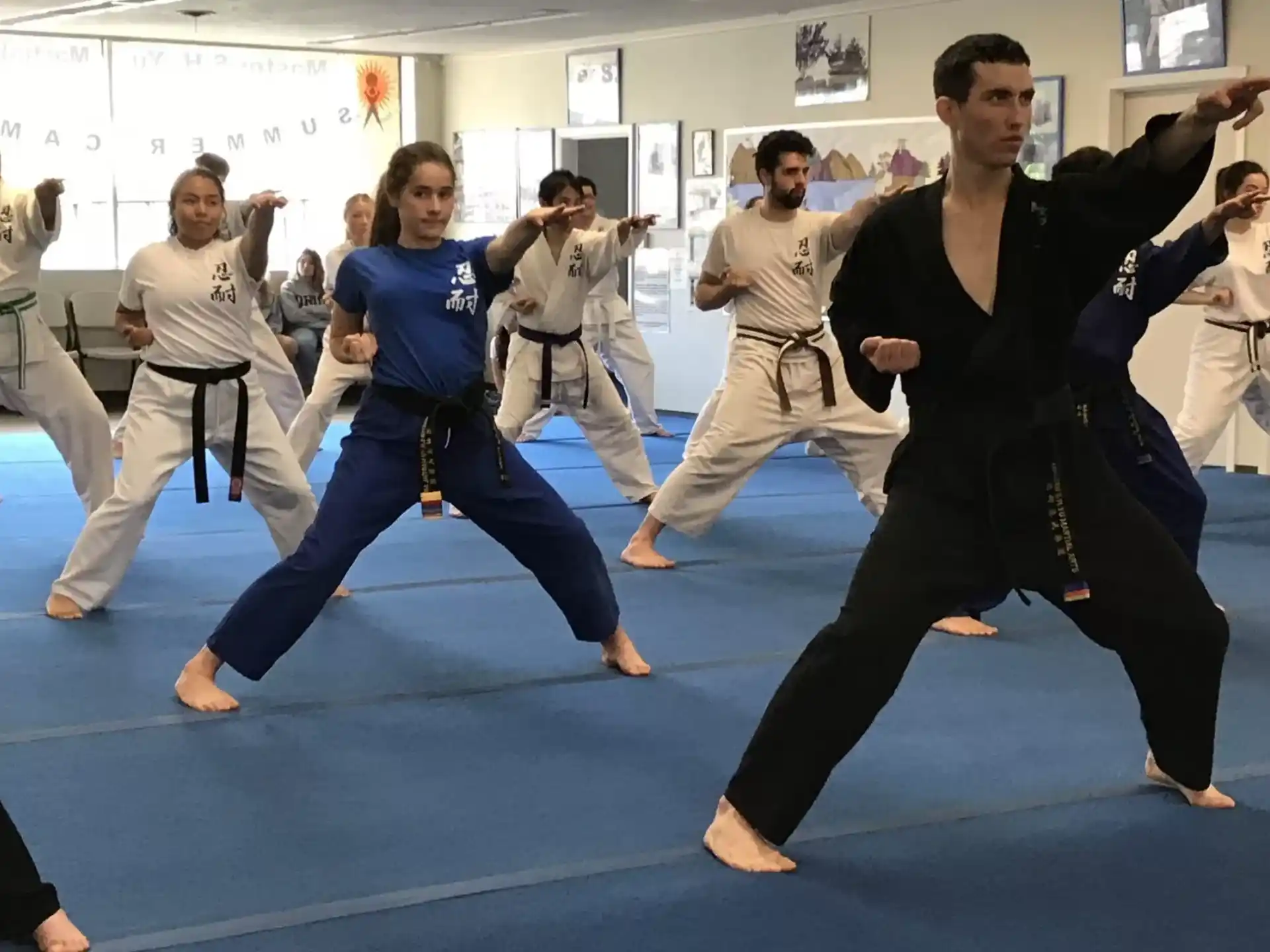a group of people in karate uniforms