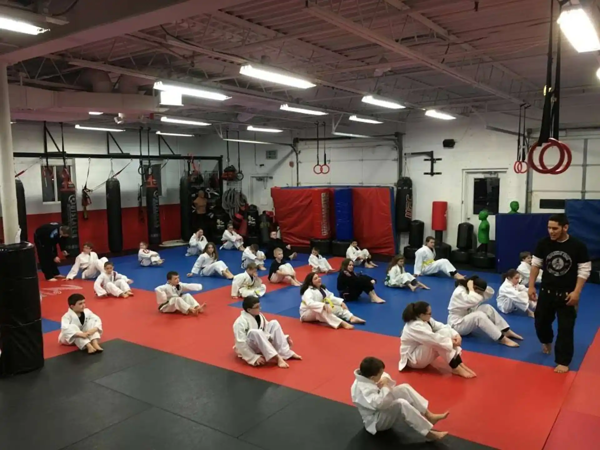 a group of people sitting on the floor in a room